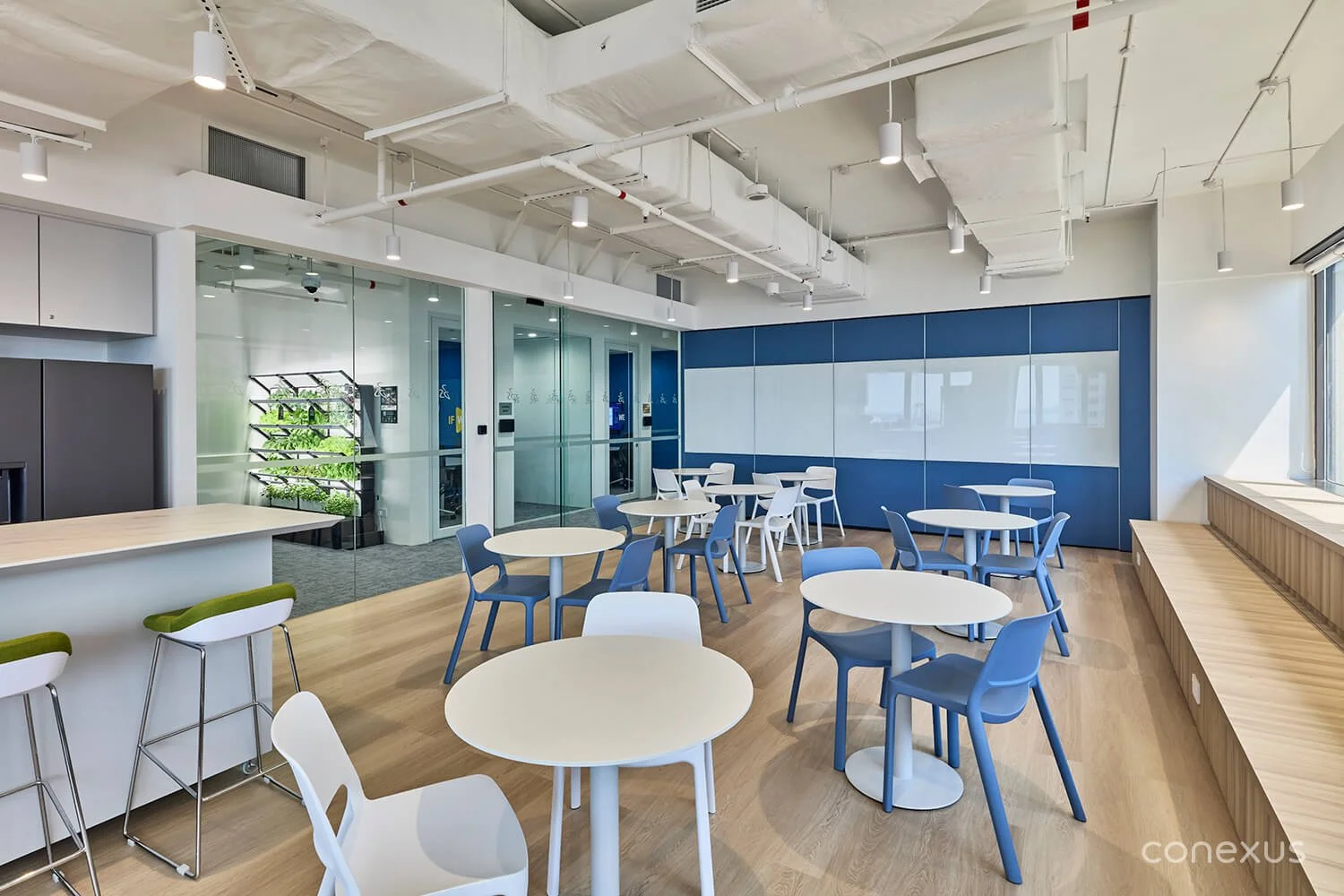  Bathed in natural light and overlooking the port and city beyond, the pantry serves as a rejuvenating destination for moments of respite amid the workday. 