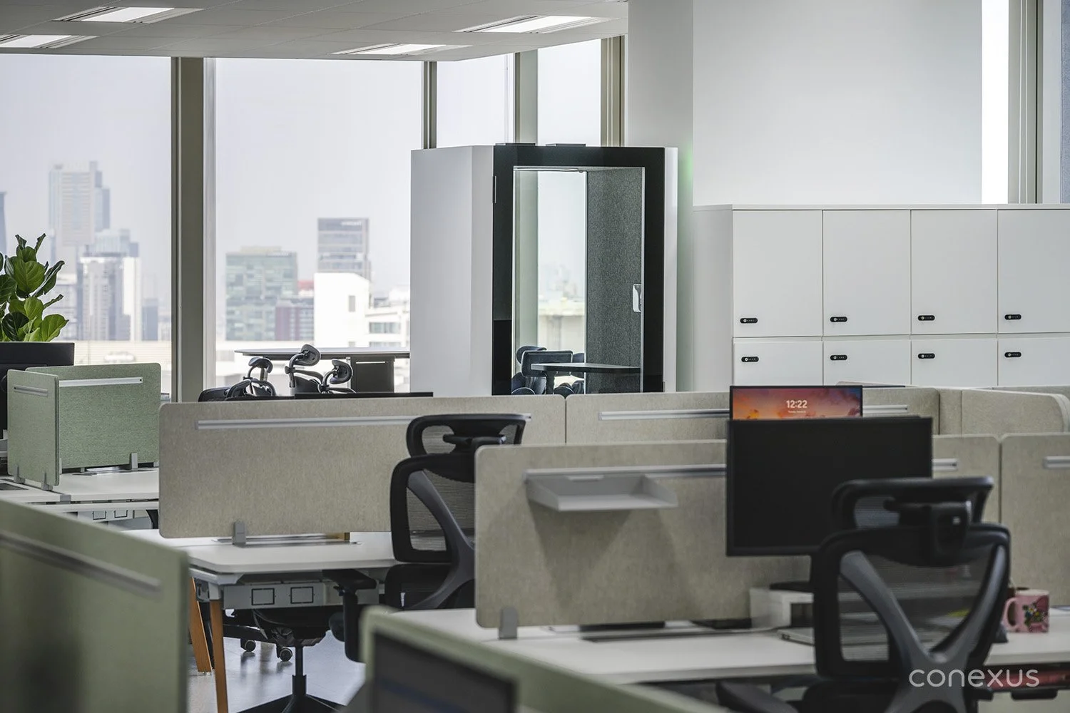 Samsonite workplace open workstation phone pod city view Bangkok