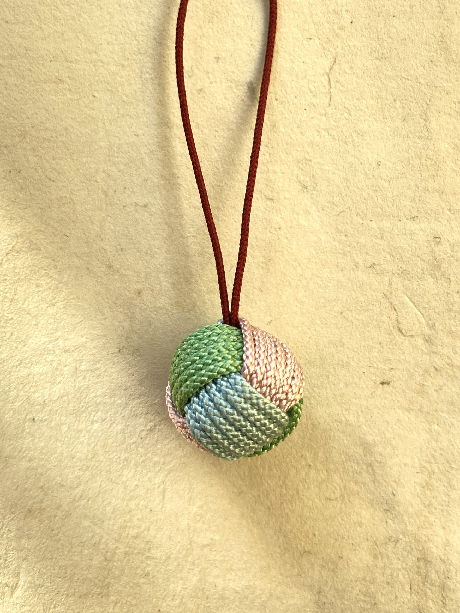 Lucky Knot made out of silk, in the colors rose, light blue, mint