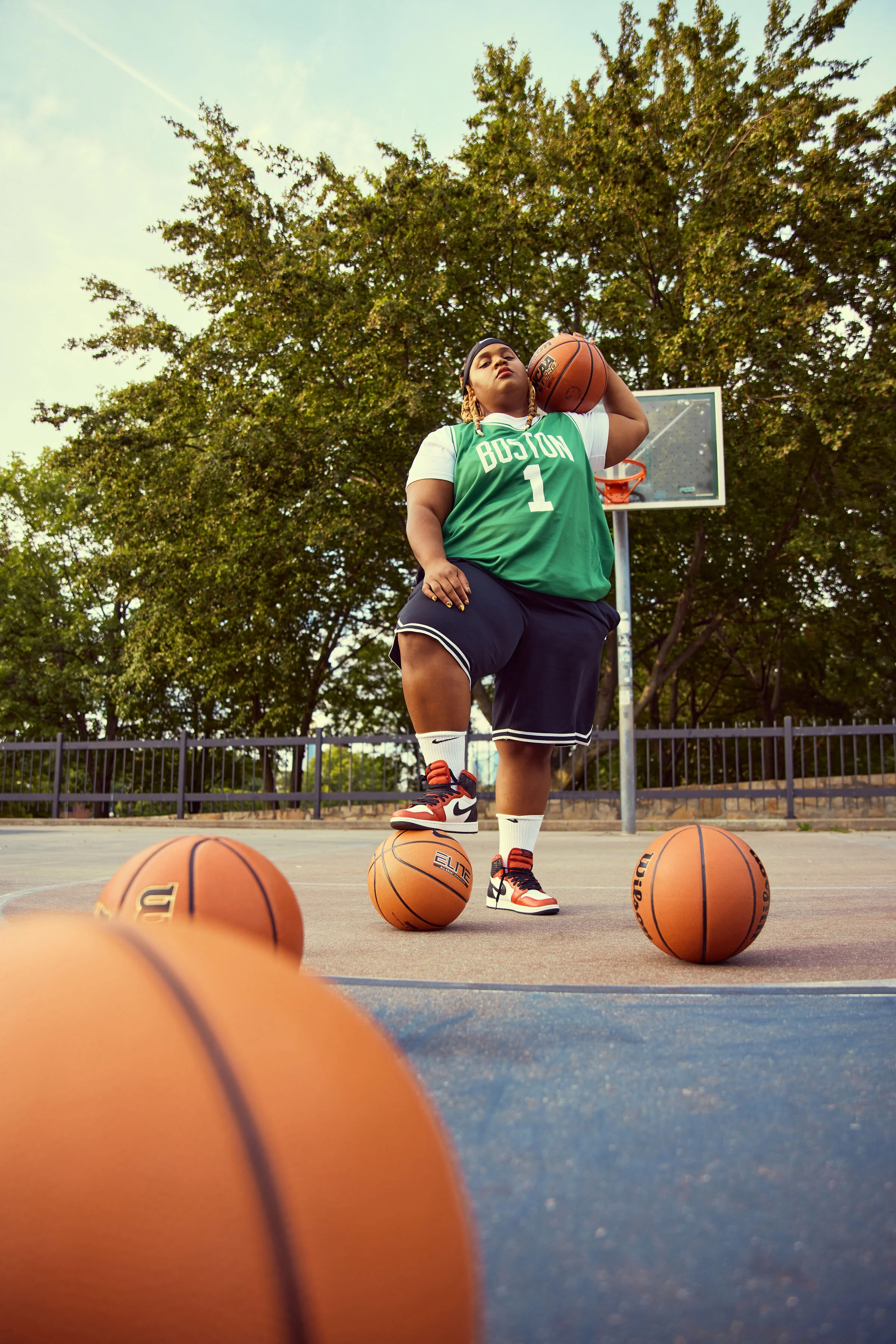 Oompa wears Jersey NBA, custom; Shorts Nike; Shoes Nike Jordan Retro High Satin Snakes; Styled by herself and photographed by Ally Schmaling