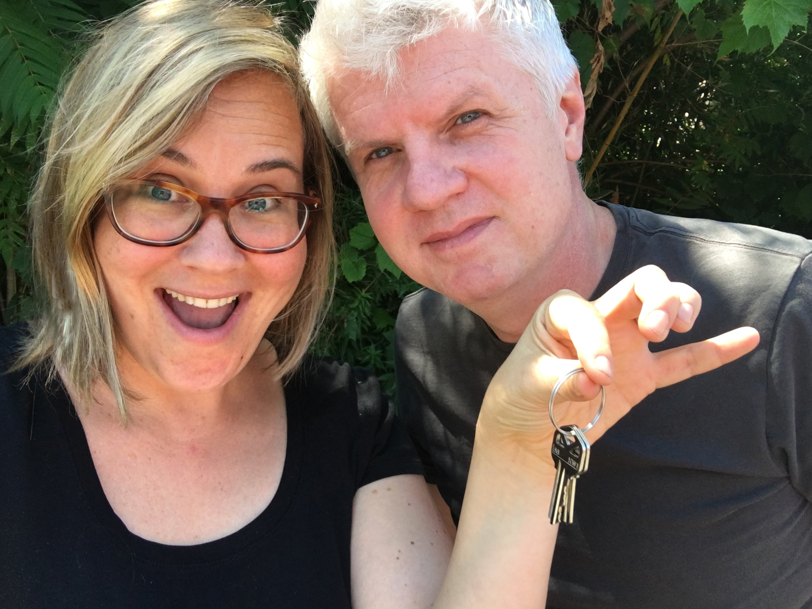 Megan and her husband Robert with the keys to their new home in Kerhonkson, just after the closing!
