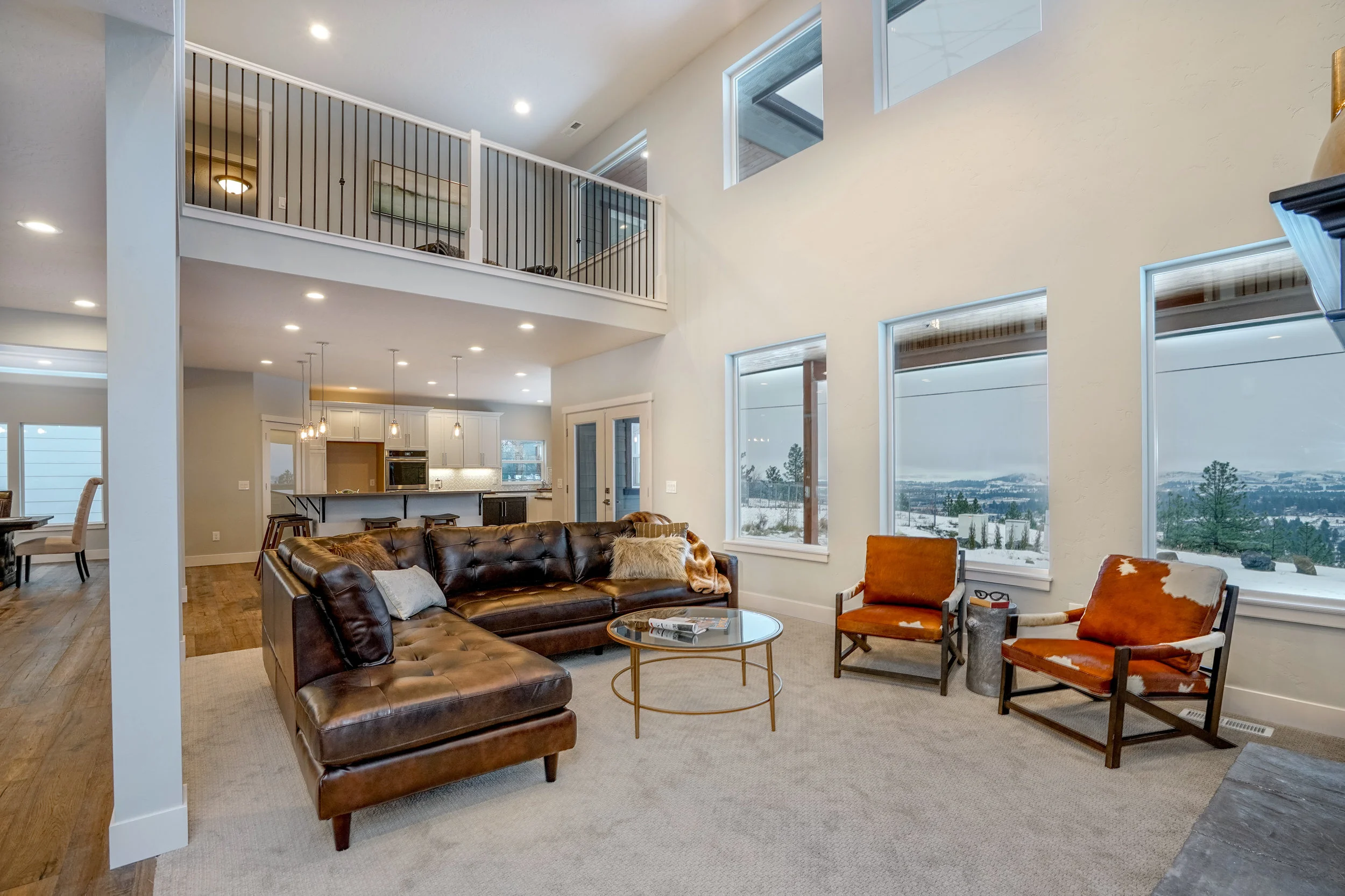 Great room and kitchen overlooking snowy Spokane, Washington