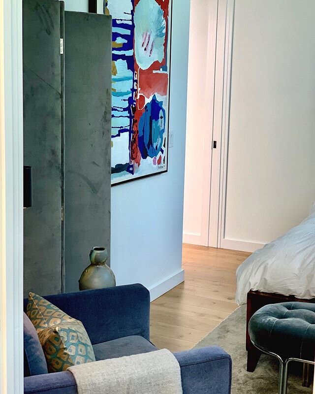 Master bedroom in grays and blues. Room divider: @theinside, Sofa chair: @mgbwhome, Bench: @cb2 original fine art by @kelly_porter_art curated from the gallery of @weinbergerfineart @kimweinberger #loudoninteriordesign  #austininteriordesign #interio