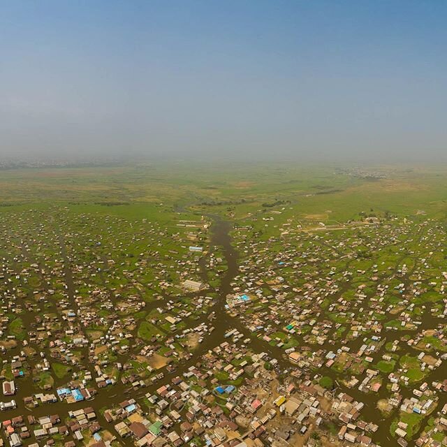 Super rare + 180 degree pano (please swipe) of the African Venice, the village of Ganvie, Benin. Thousands of lives striving over the lake&rsquo;s surface, with a maternity, mosque, fresh water supply, markets and many other facilities. Can you count