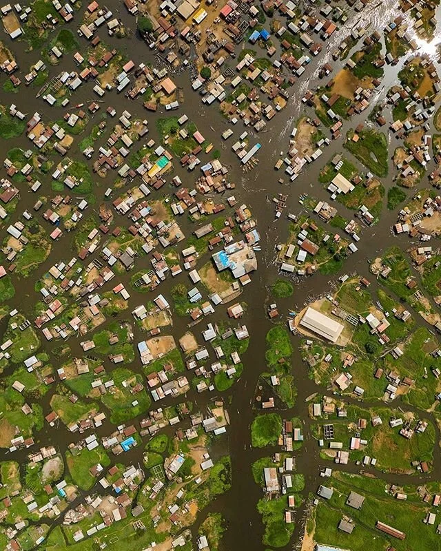 Aerial view over the &ldquo;African Venice&rdquo;, the village of Ganvie, not so far away from Cotonou, Benin. The intricate network of canals, palafitic houses and transportation is mind blowing. (C) Joel Santos .

#benin #benincity #bénin #cotonou