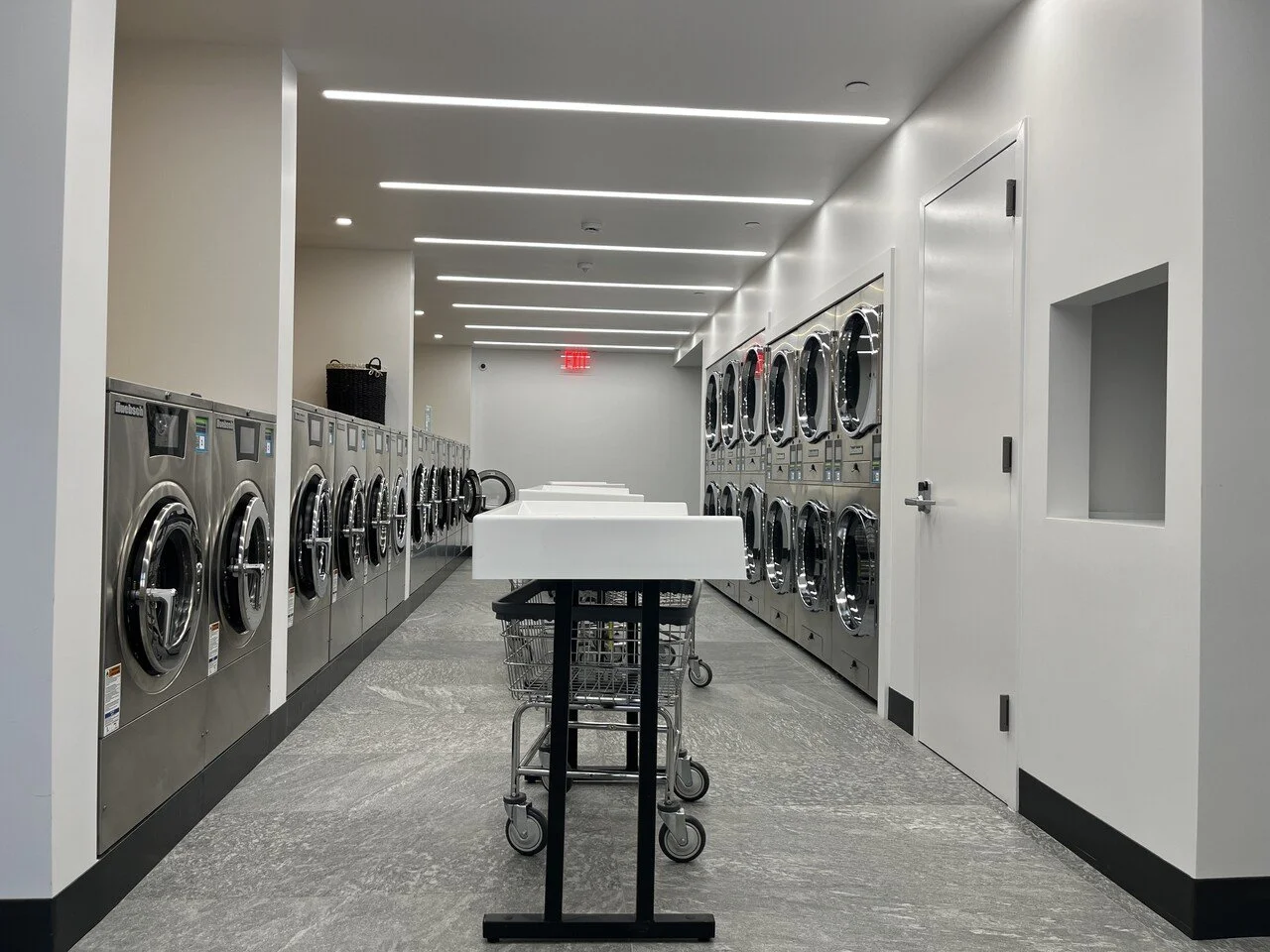 Recently Renovated Laundry Room with top level appliances in Washington Heights Multifamily Amenities Renovation by Rojas AP.jpeg