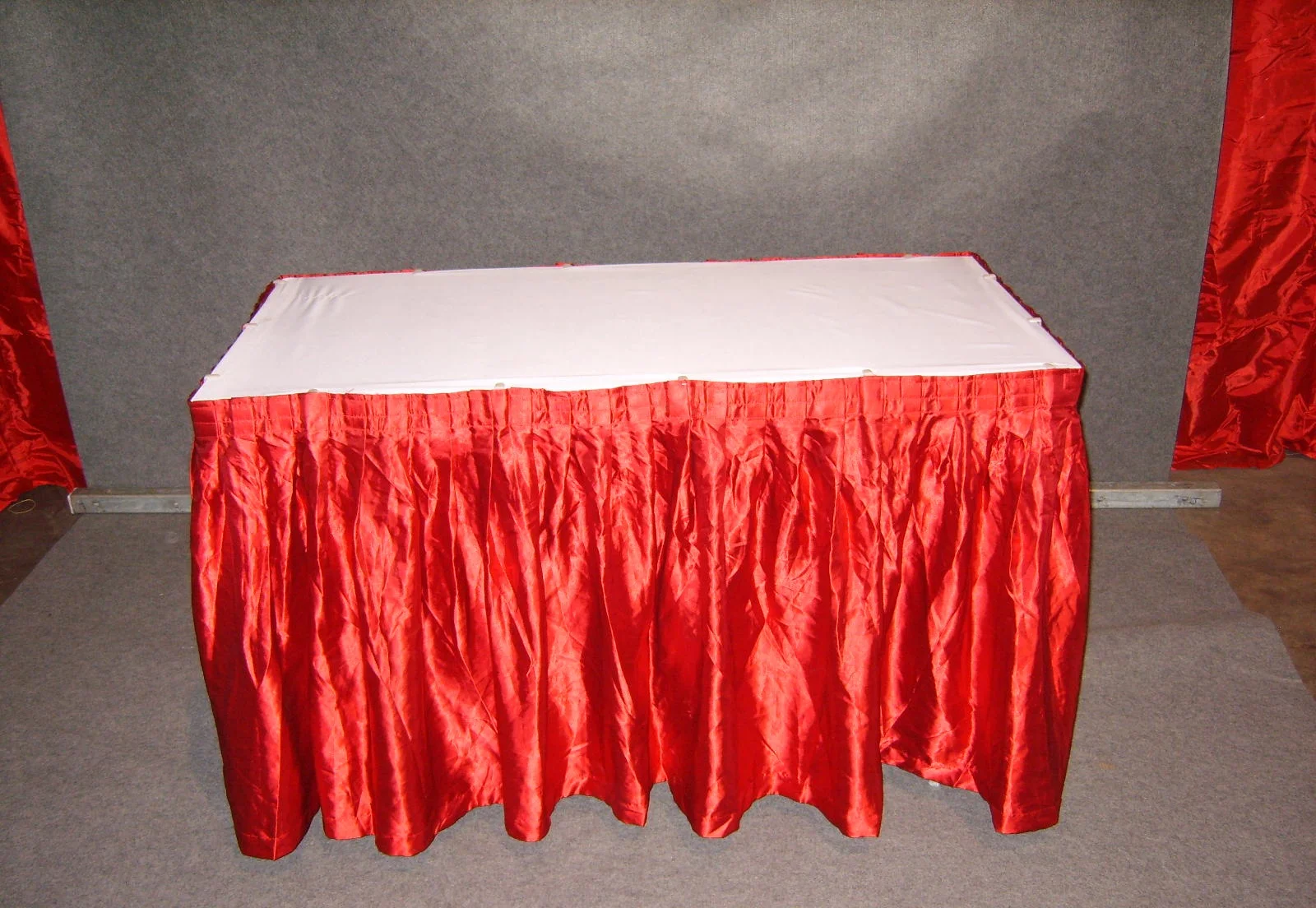 2x4' table w/ red skirting