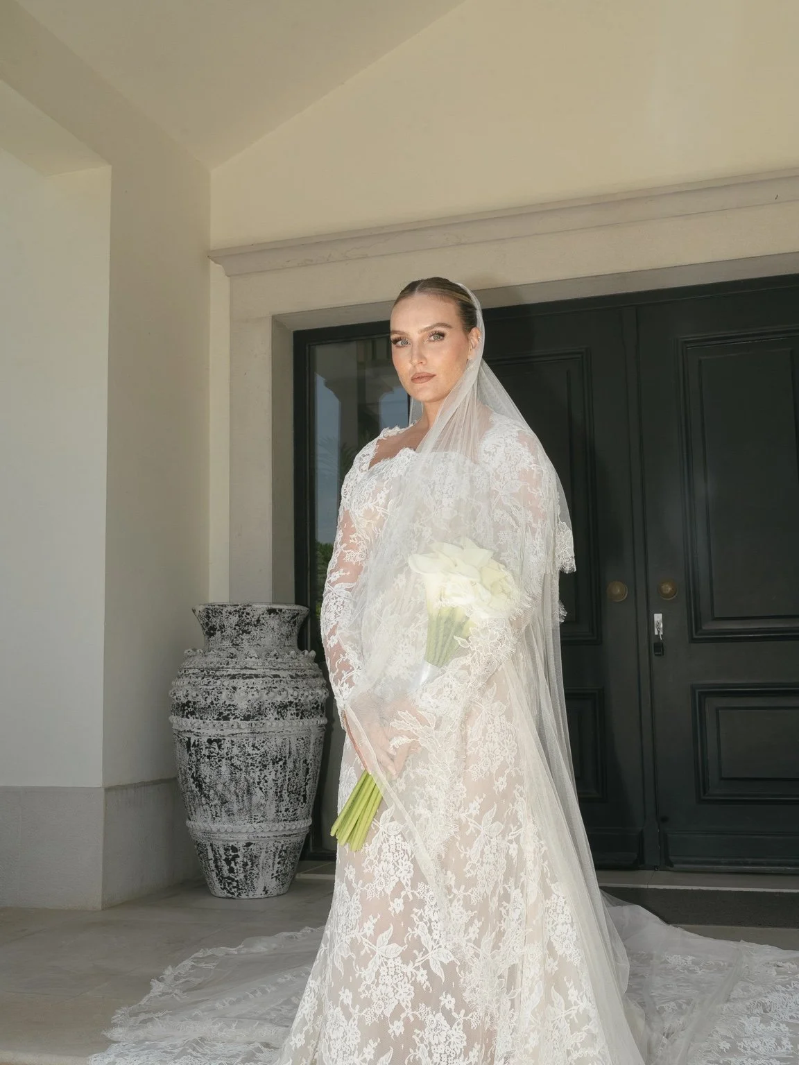 Perrie in her lace wedding gown before the ceremony