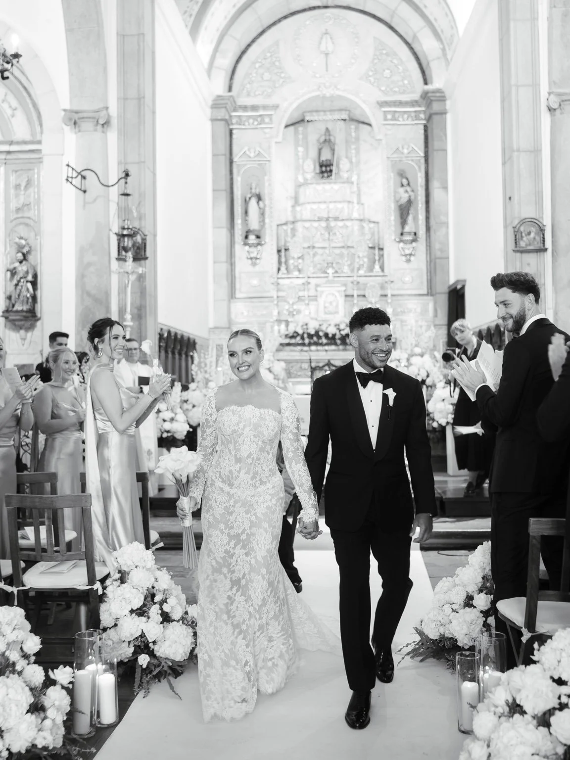 Perrie and Alex inside the Estoi church in black and white