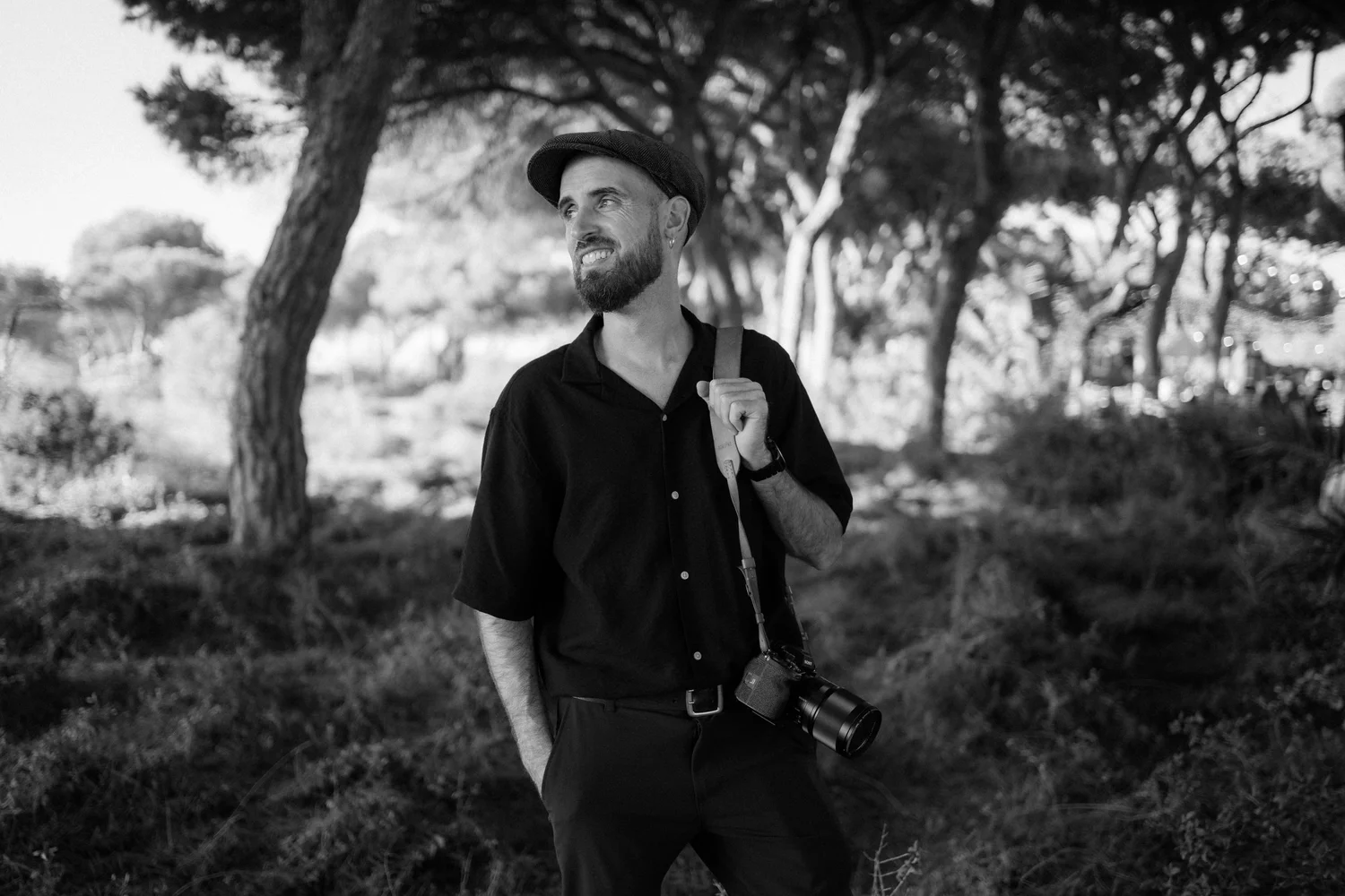 Vando of The Daniels, wedding photographer in Portugal, carrying his camera outdoors