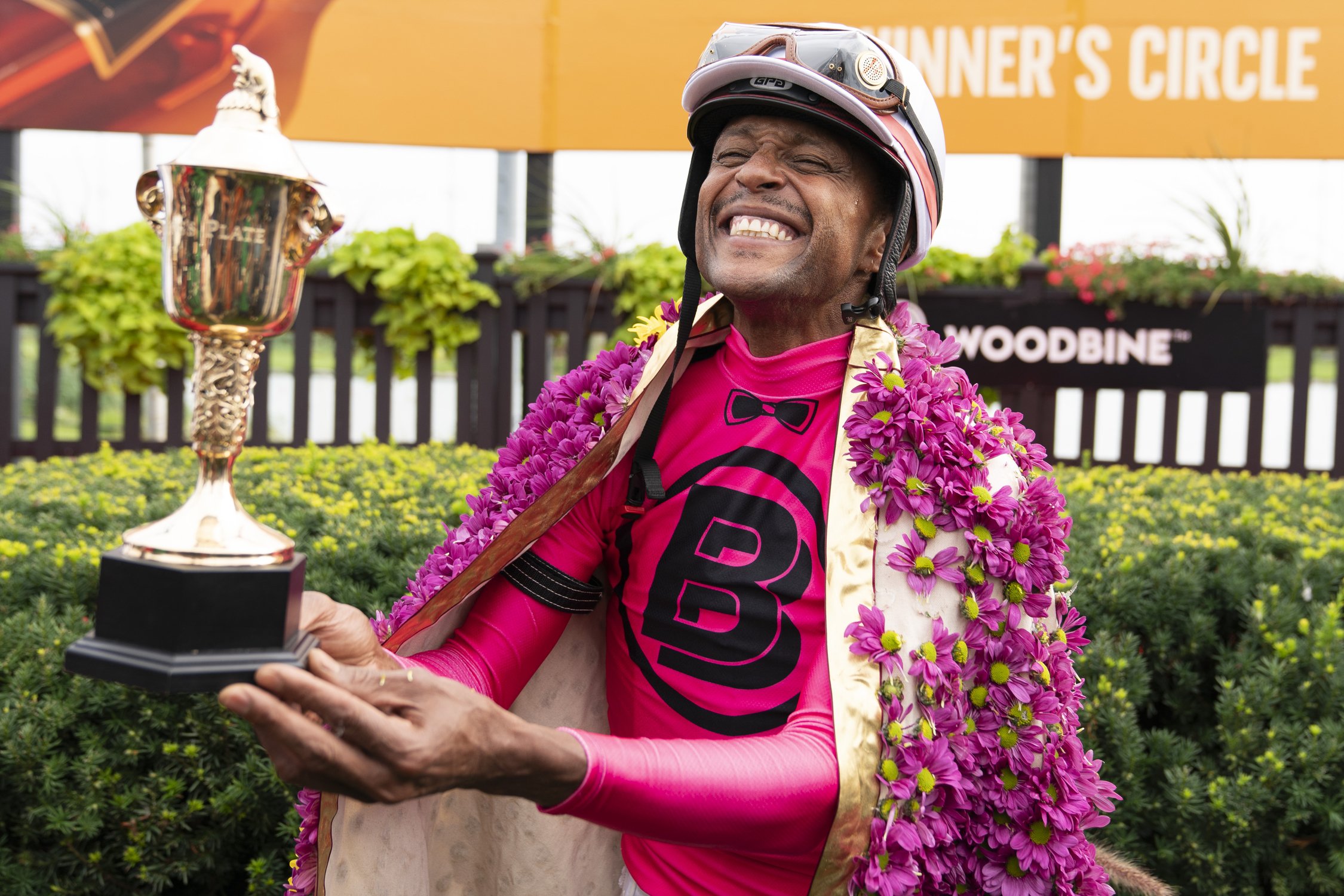  Jokey Patrick Husbands who was abroad horse Paramount Prince smiles with the trophy after claiming the 164th running of the Kings’s Plate horse race in Toronto on Sunday, August 20, 2023. THE CANADIAN PRESS/Spencer Colby 