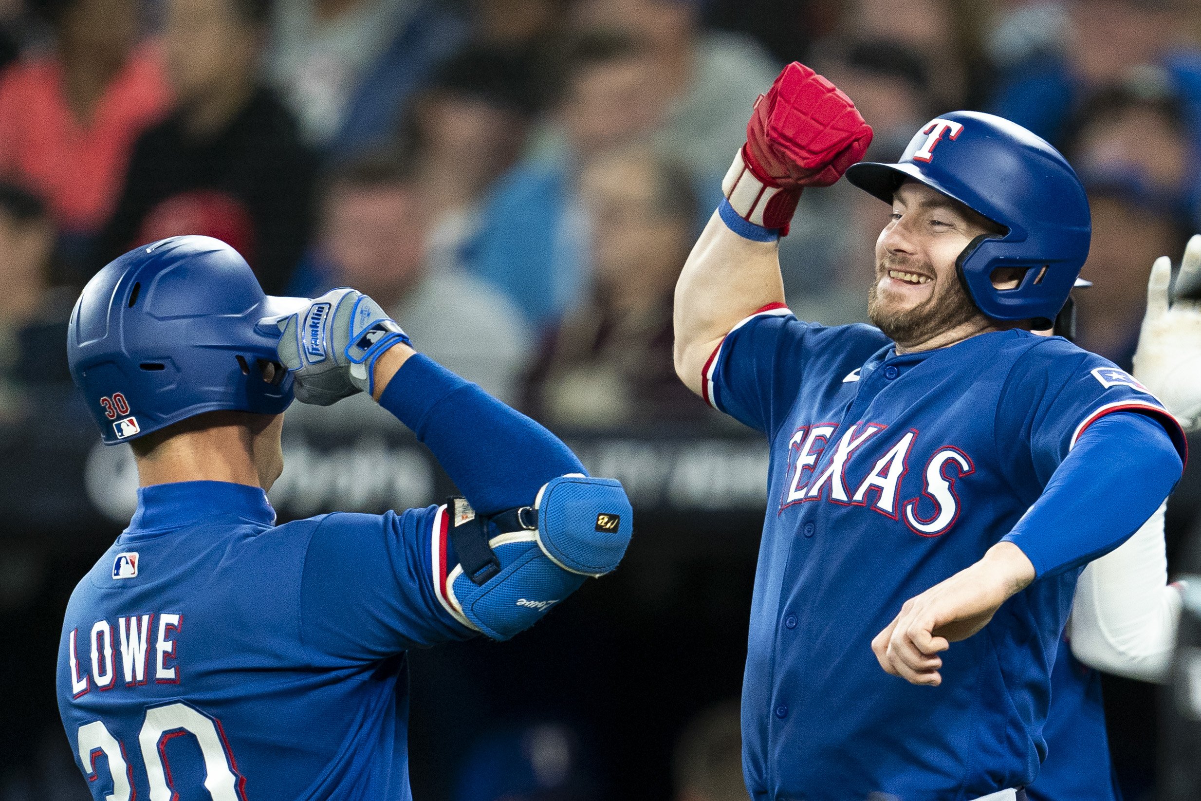 Texas Rangers' Nathaniel Lowe (left) celebrates his three-run home run against the Toronto Blue Jays with Robbie Grossman (right) during fourth inning American League MLB baseball action in Toronto, on Wednesday, Sept. 13, 2023. THE CANADIAN PRESS/S