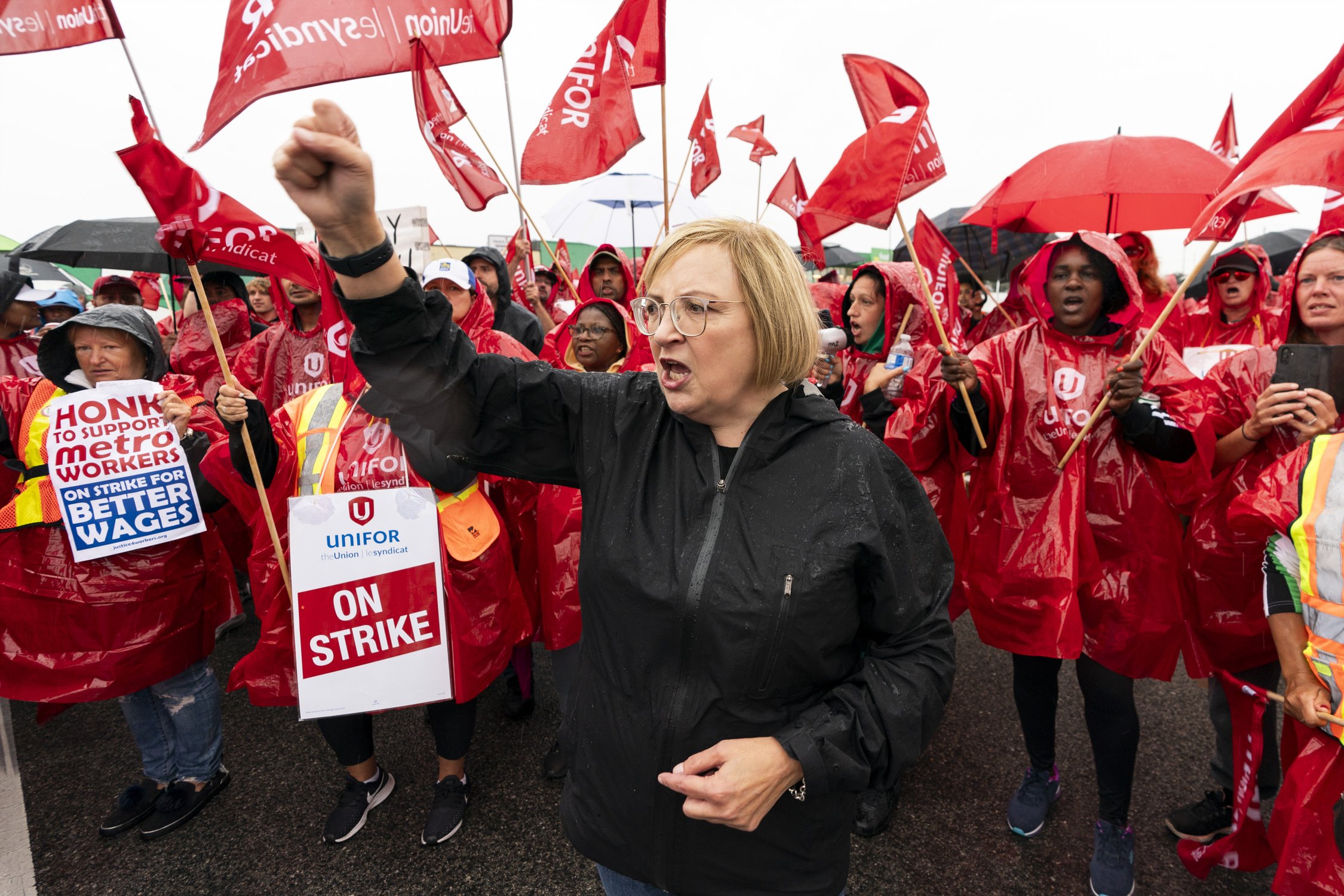  Unifor National President Lana Payne leads a chant infant of striking employees of the grocery store Metro are seen on the picket lines in Toronto, on Wednesday, Aug. 23, 2023. THE CANADIAN PRESS/Spencer Colby 
