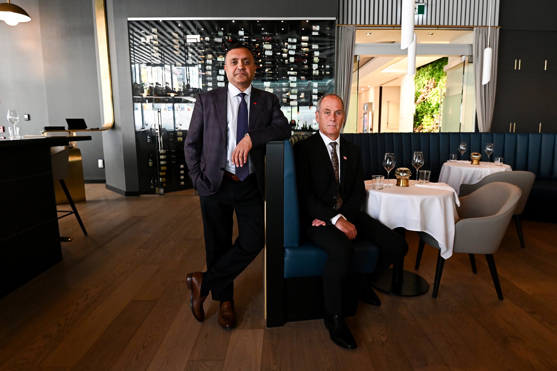  Owner of Aiana Restaurant Collective Devinder Chaudhary, left, and server Robert Lamieux are seen in a portrait at Aiana Restaurant Collective, a no-tip fine dining restaurant in Ottawa, Ont., on Tuesday, May 30, 2022. Spencer Colby/The Globe and Ma