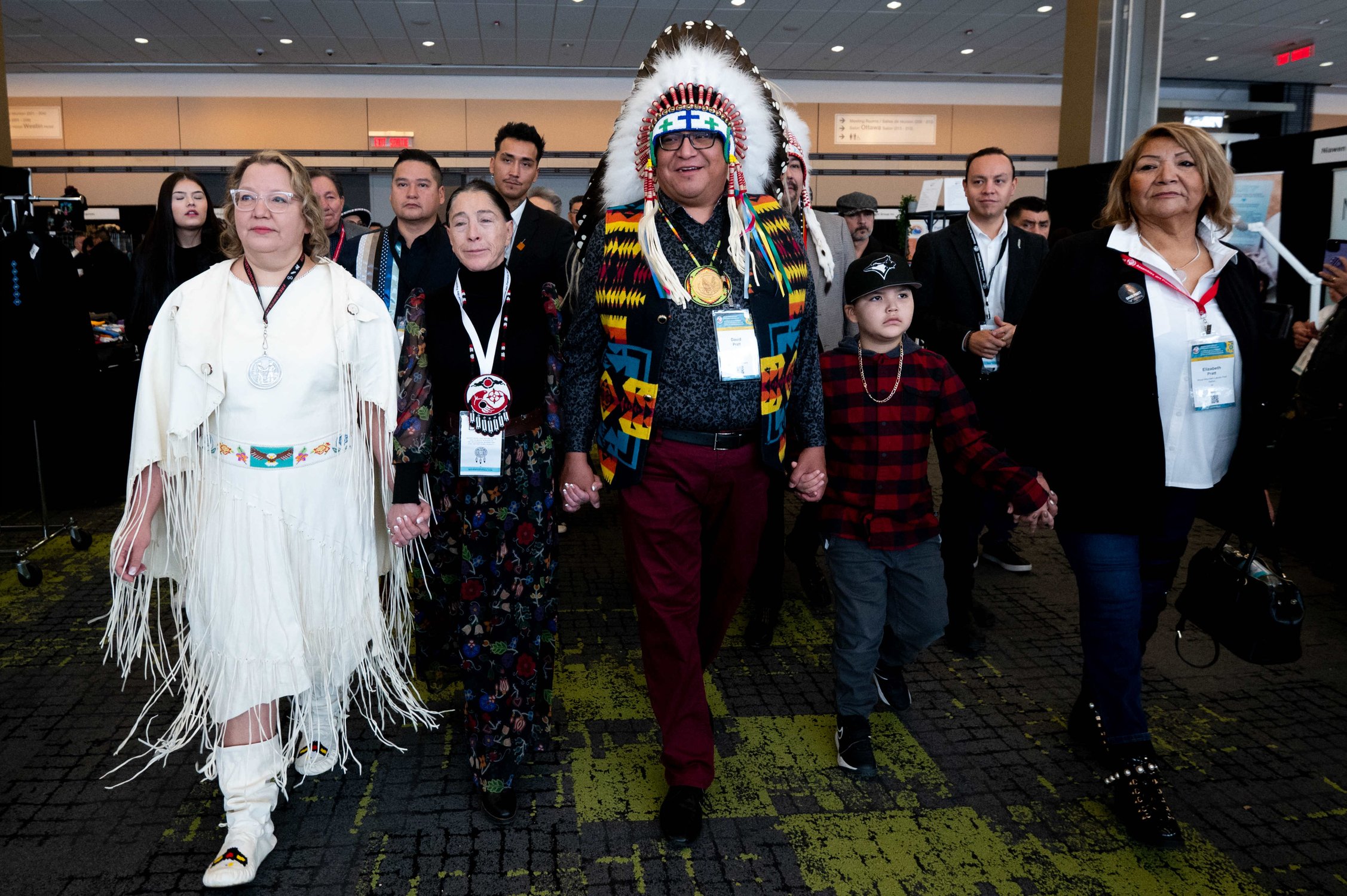  Candidate Cindy Woodhouse, left, Interim National Chief Joanna Bernard, second-left, and Candidate David Pratt, centre, walk towards the main stage during the third day of National Chief of the Assembly of First Nations during the third day of the S