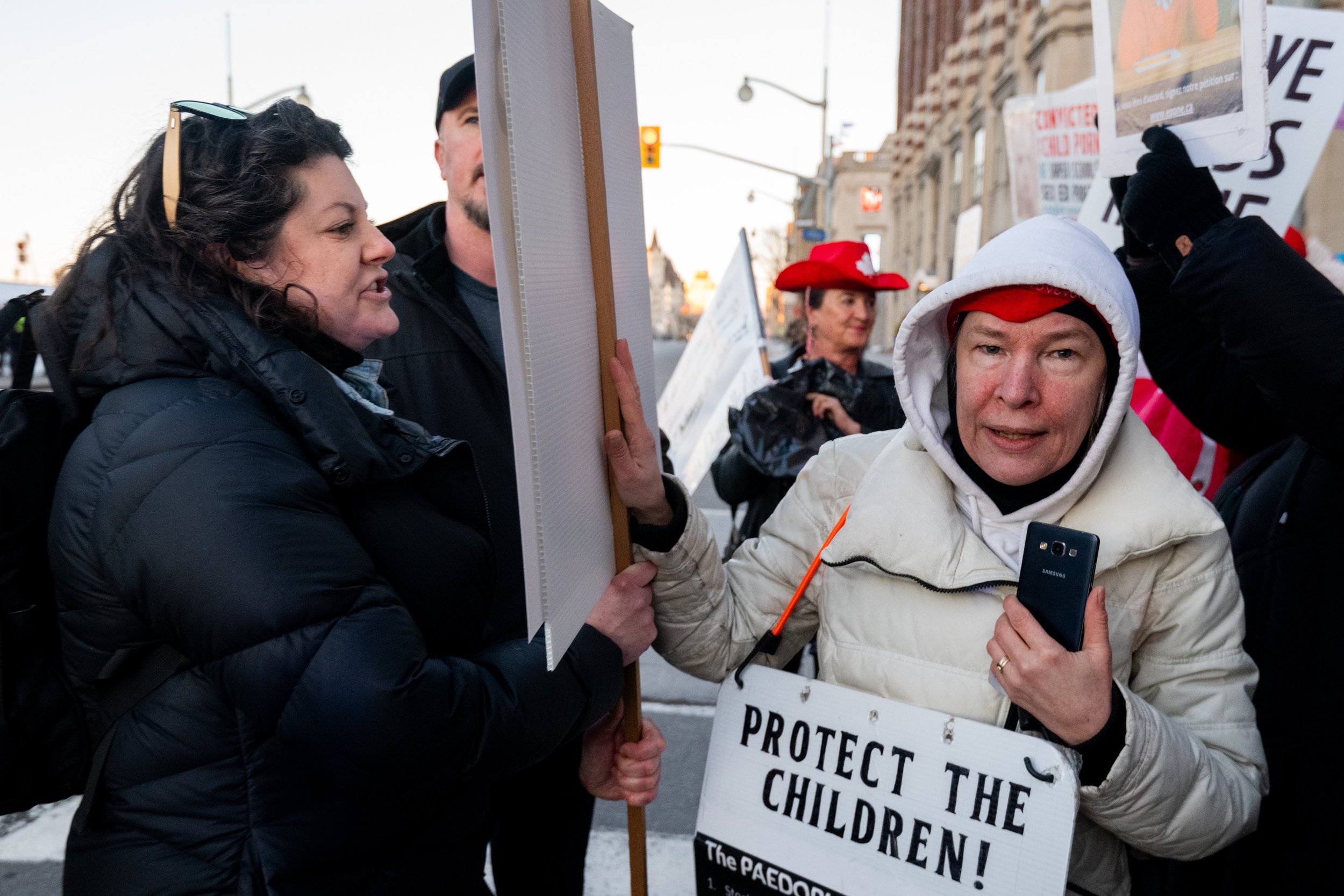  A Pro-LGBTQ2+ protestor, left, argues with a counter-protestor during a rally outside of an event where Alberta Premier Danielle Smith is expected to attend in the Parliamentary Precinct of Ottawa, on Monday, Feb. 5, 2024. Spencer Colby/Postmedia 