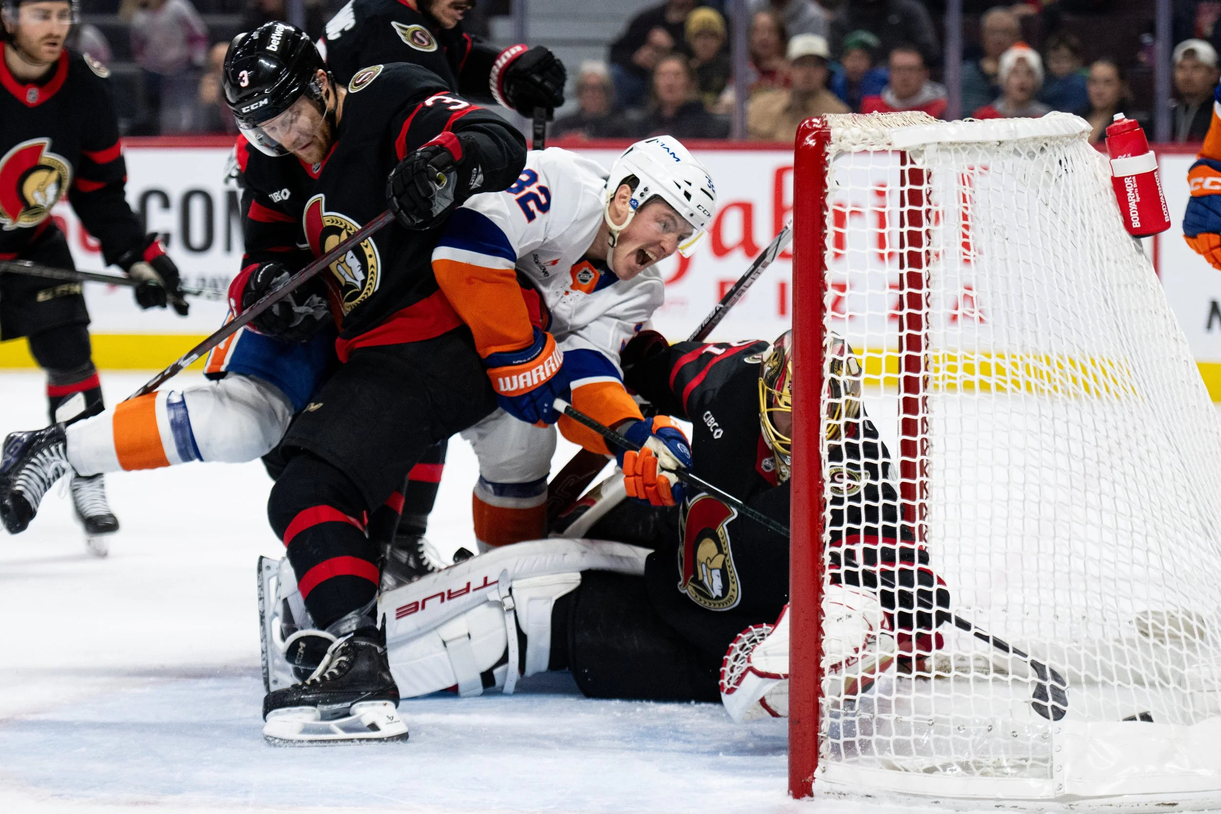  New York Islanders centre Kyle MacLean (32) scores on Ottawa Senators goaltender Anton Forsberg (31) during first period NHL hockey action in Ottawa, on Sunday, Dec. 8, 2024. THE CANADIAN PRESS/Spencer Colby 