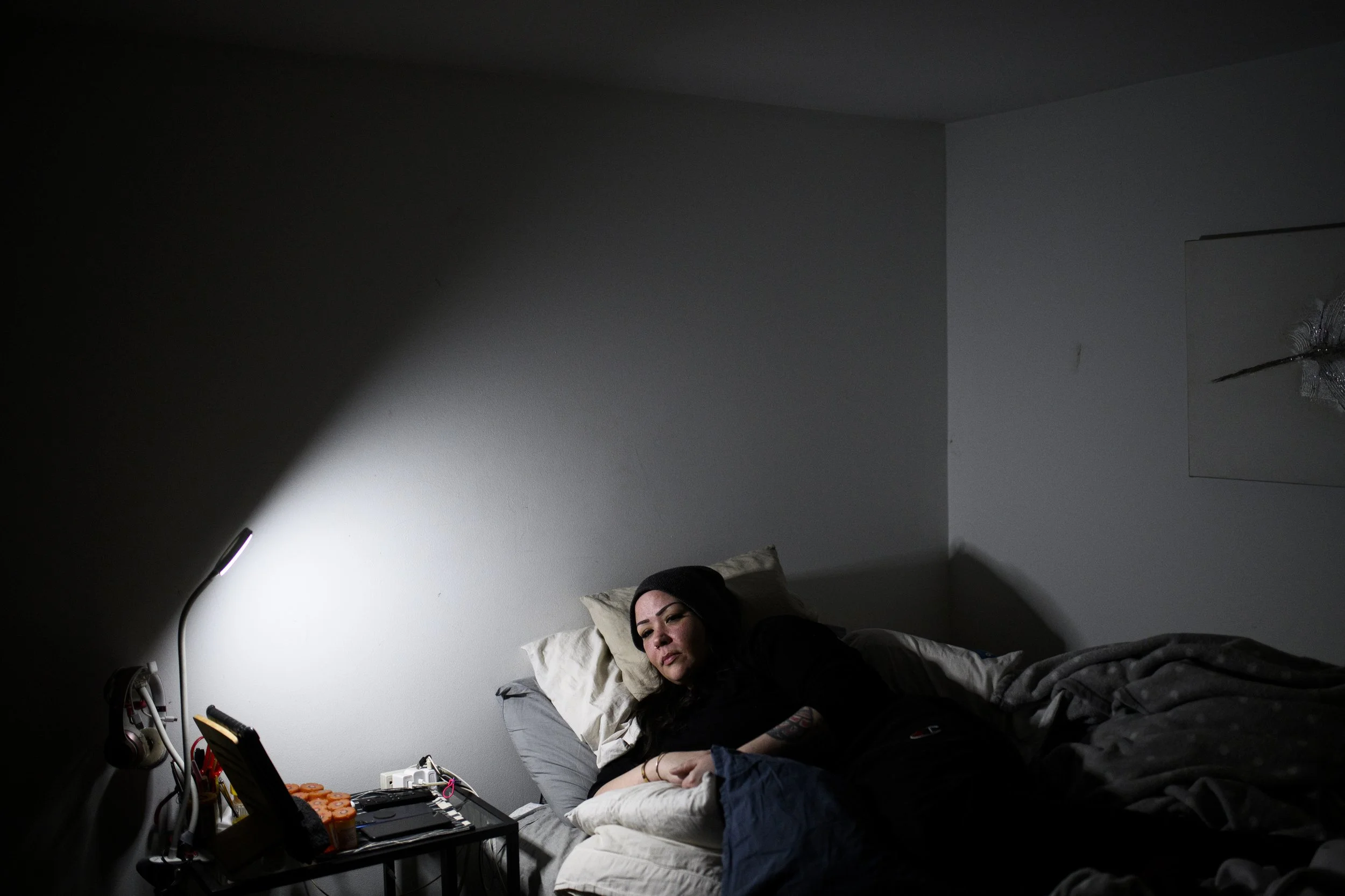  Amanda Godda poses for a picture in her home in Ottawa, on Tuesday, Dec. 16, 2025. Godda, 42, suffers from chronic pain and has been bedridden since August 2025. THE CANADIAN PRESS/Spencer Colby 
