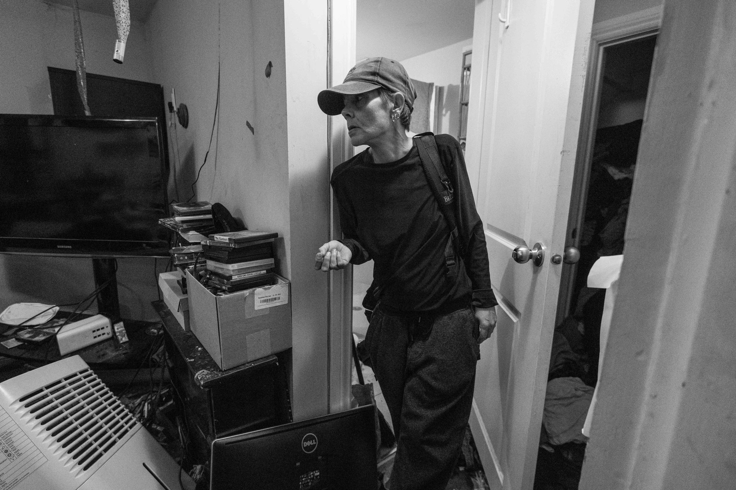  Thumper looks into her living room as she stands in the doorway of her basement unit apartment building in Ottawa’s Glebe neighbourhood 
