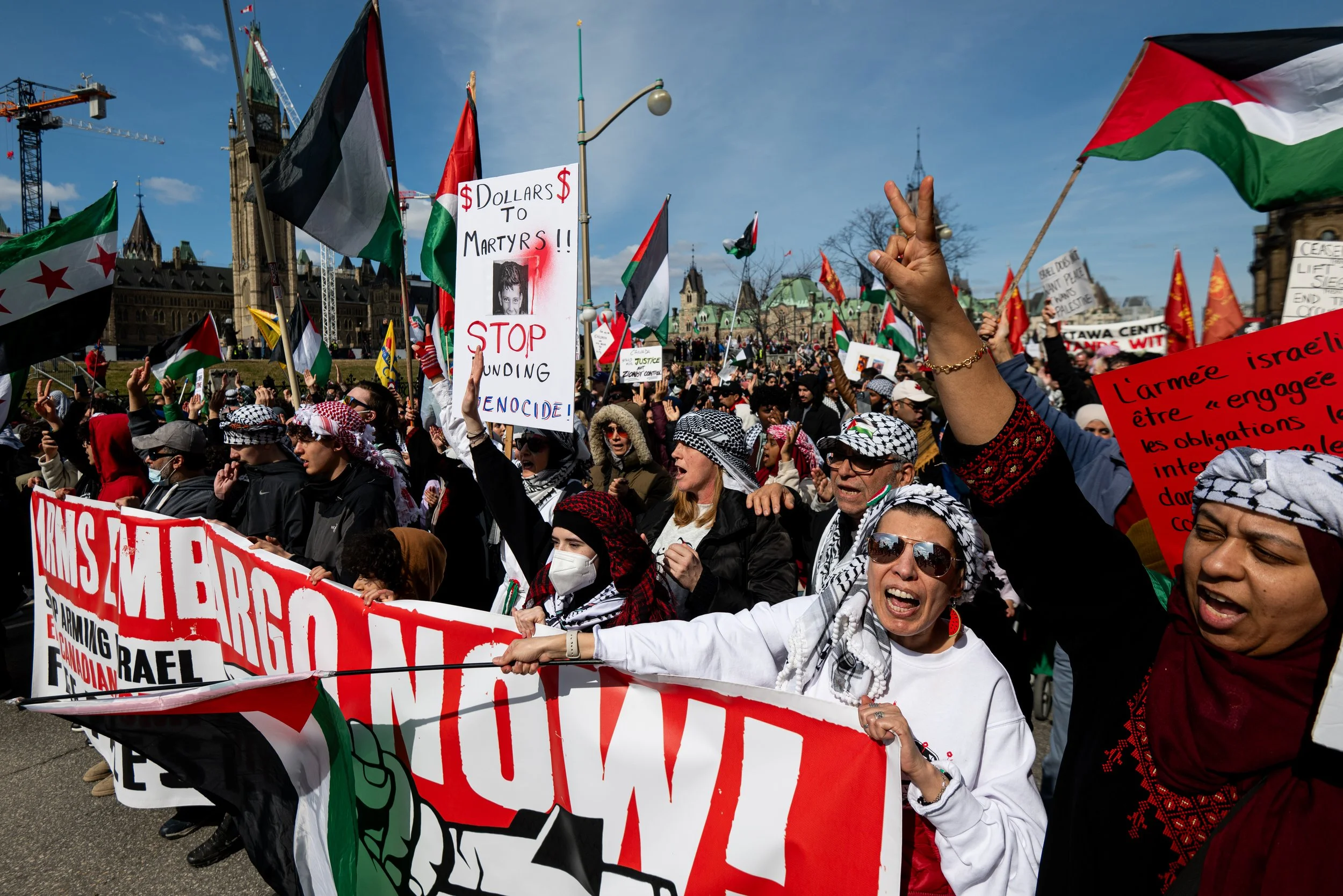 Pro-Palestinian protestors chant during a 'National March for Palestine' demonstration near Parliament Hill in Ottawa, on Saturday, April 12, 2025. THE CANADIAN PRESS/Spencer Colby 