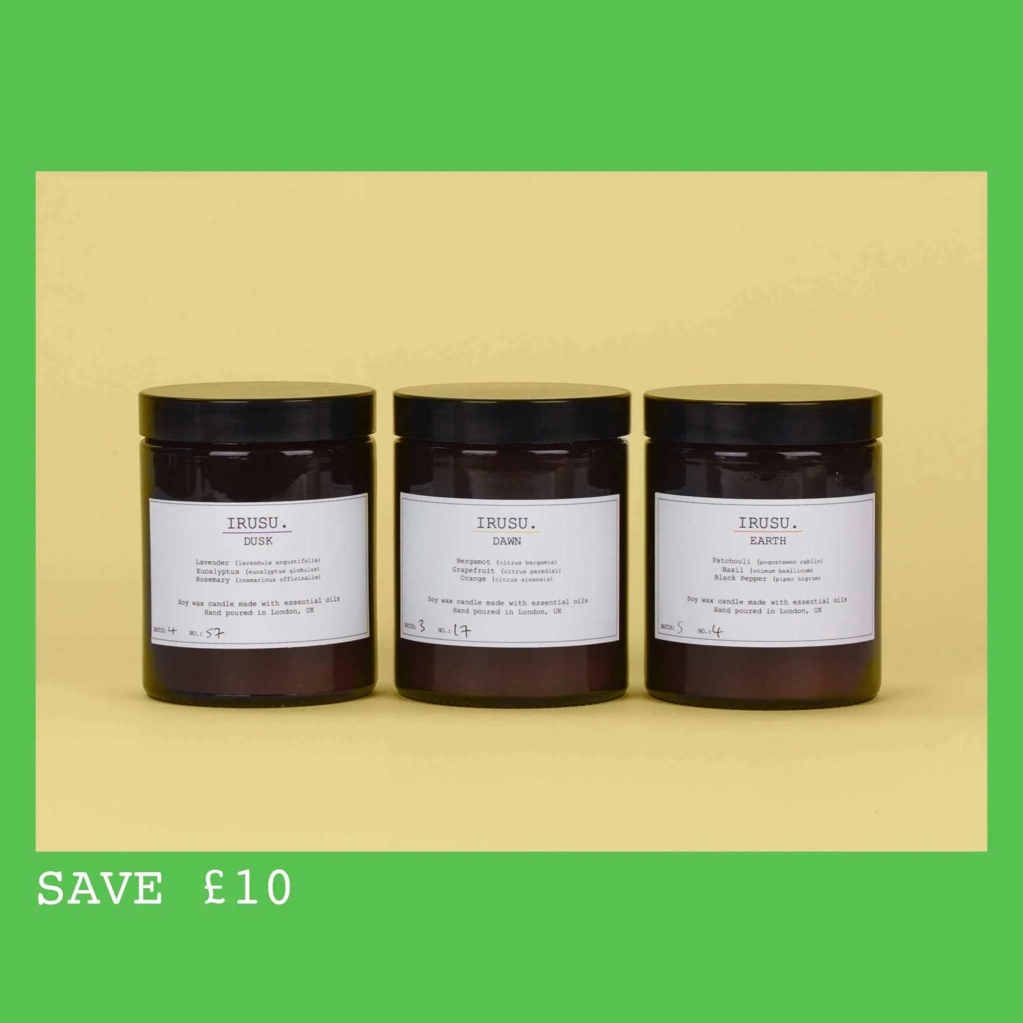 Three soy wax candles in amber jars on a yellow background. 180ml with up to 45 hour burn times the white stickers tell us the scents, they say “IRUSU. EARTH,” “IRUSU. DAWN” & “IRUSU. DUSK”