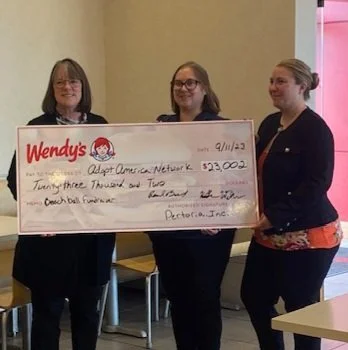 AAN presented with a $23,002 check from local Wendy's Restaurants