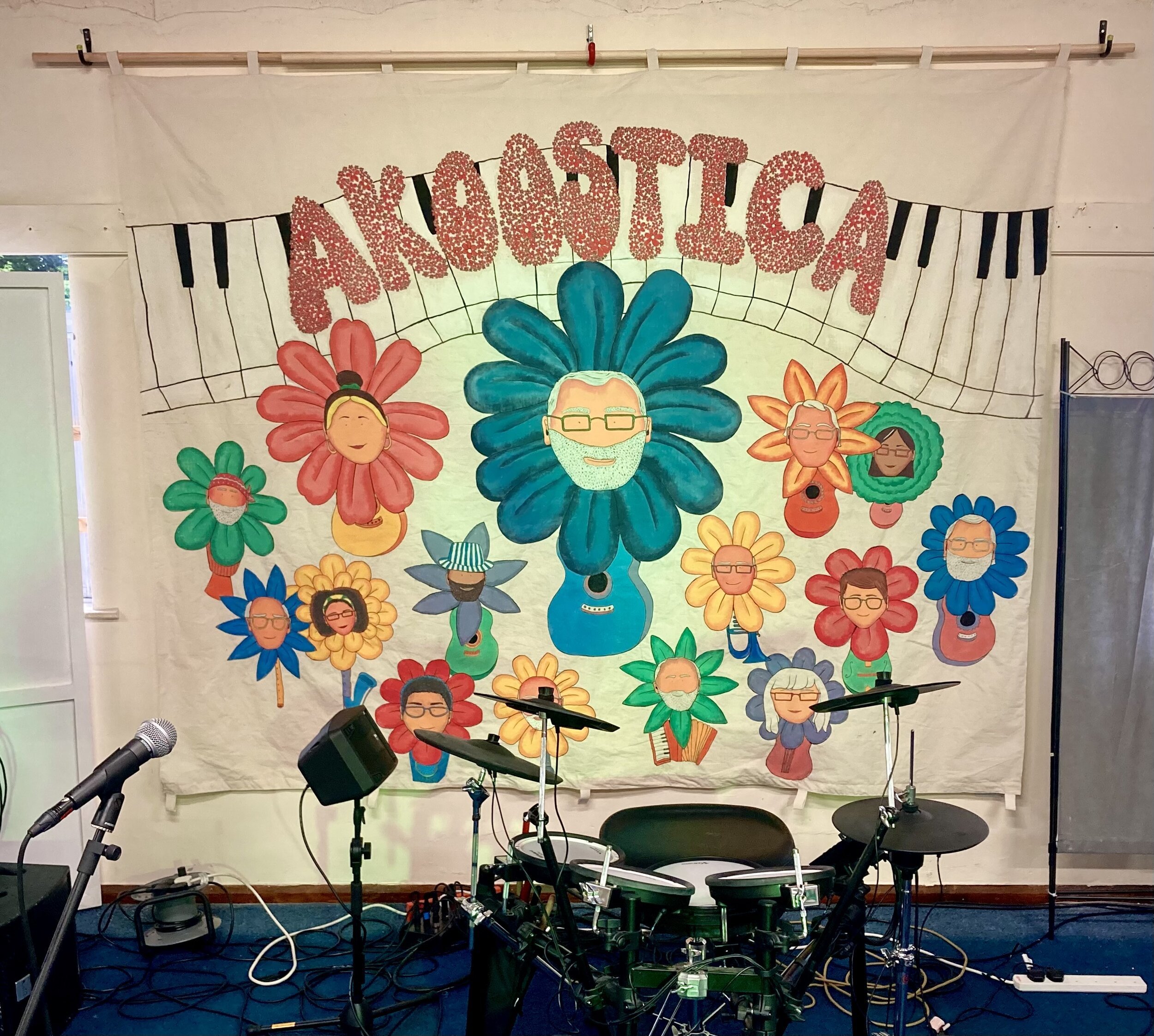 Akoostica open mic night stage backdrop.