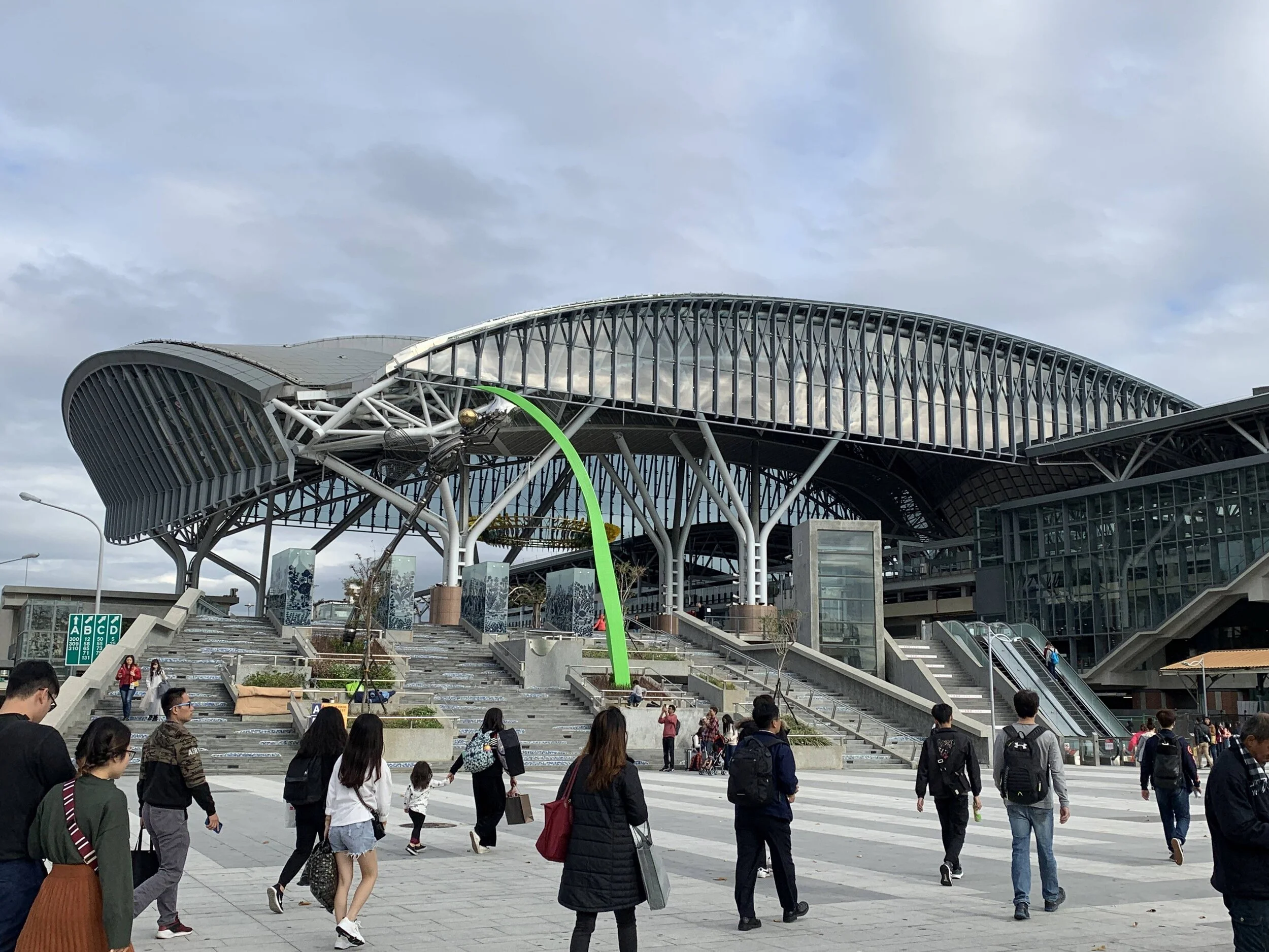 The new modern train station is built right next to the decommissioned old train station.