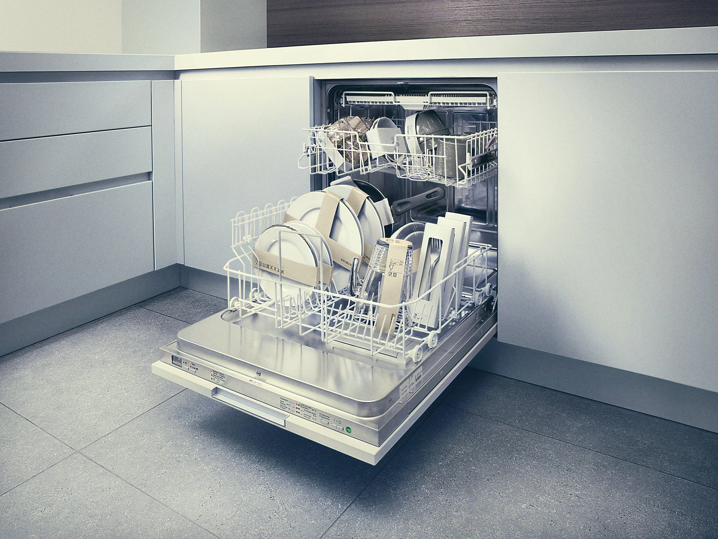 Open dishwasher filled with dishes, glasses, and utensils in a modern kitchen.