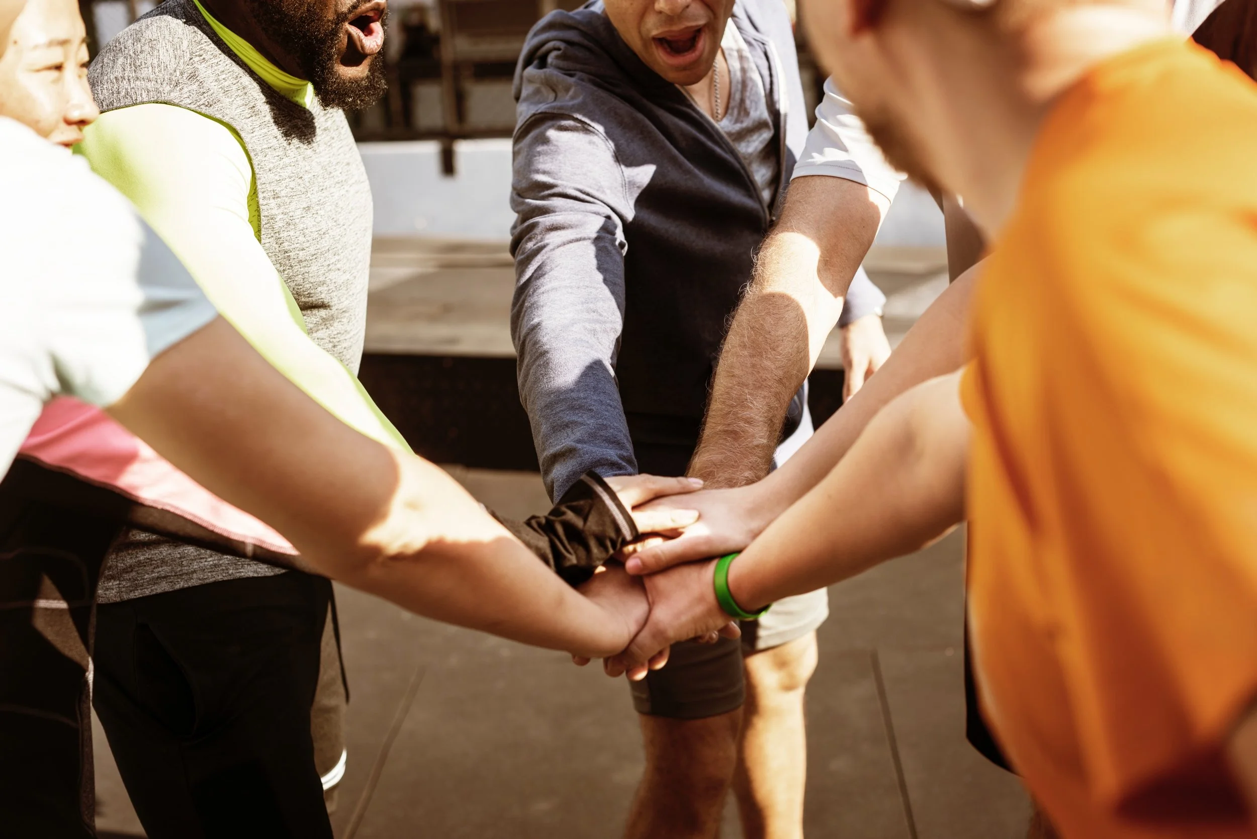 team high 5 hands in for work wellbeing positive vibes.jpg