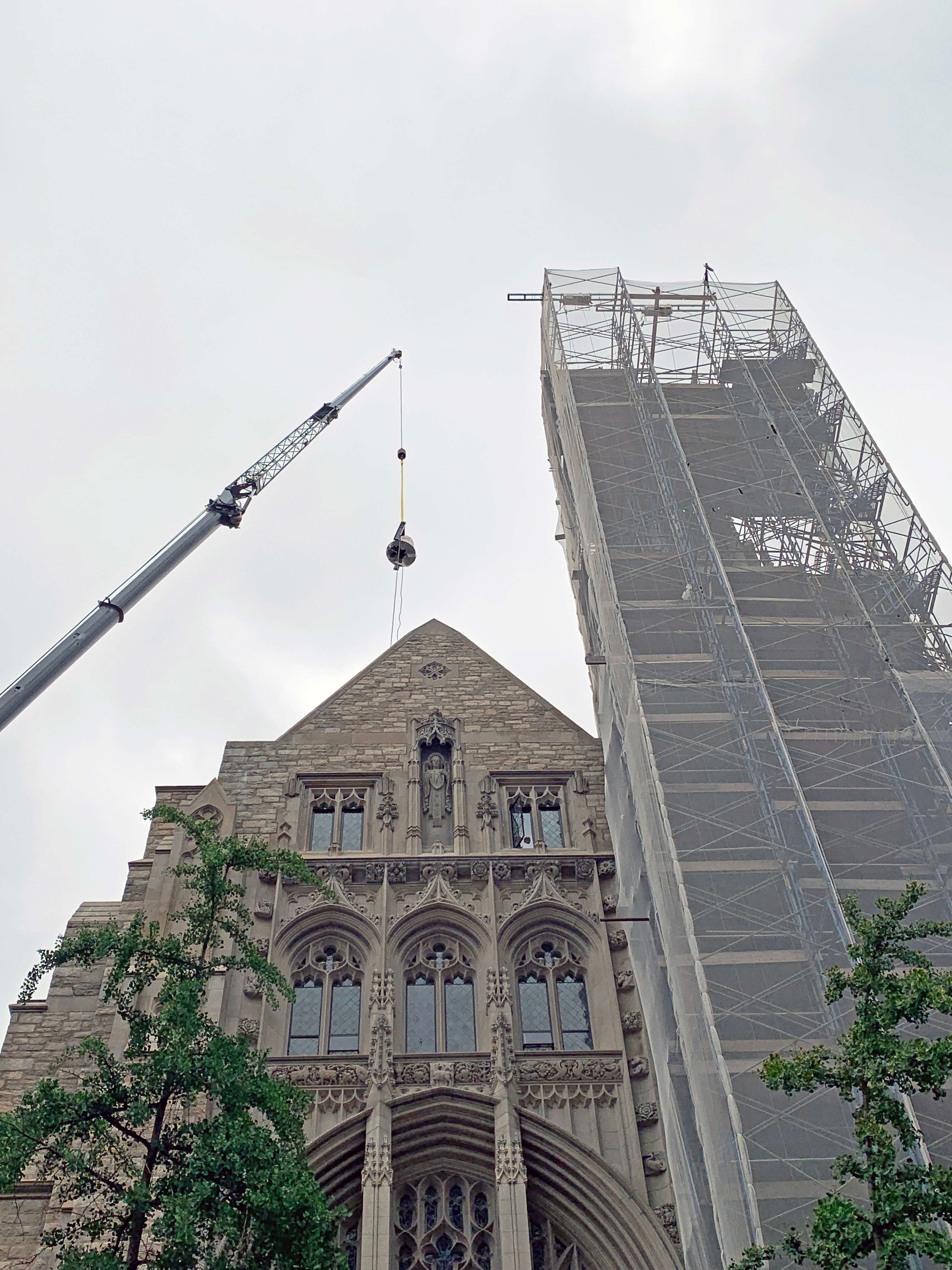 Photo showing a bell being installed. Photo courtesy of Walter B. Melvin Architects