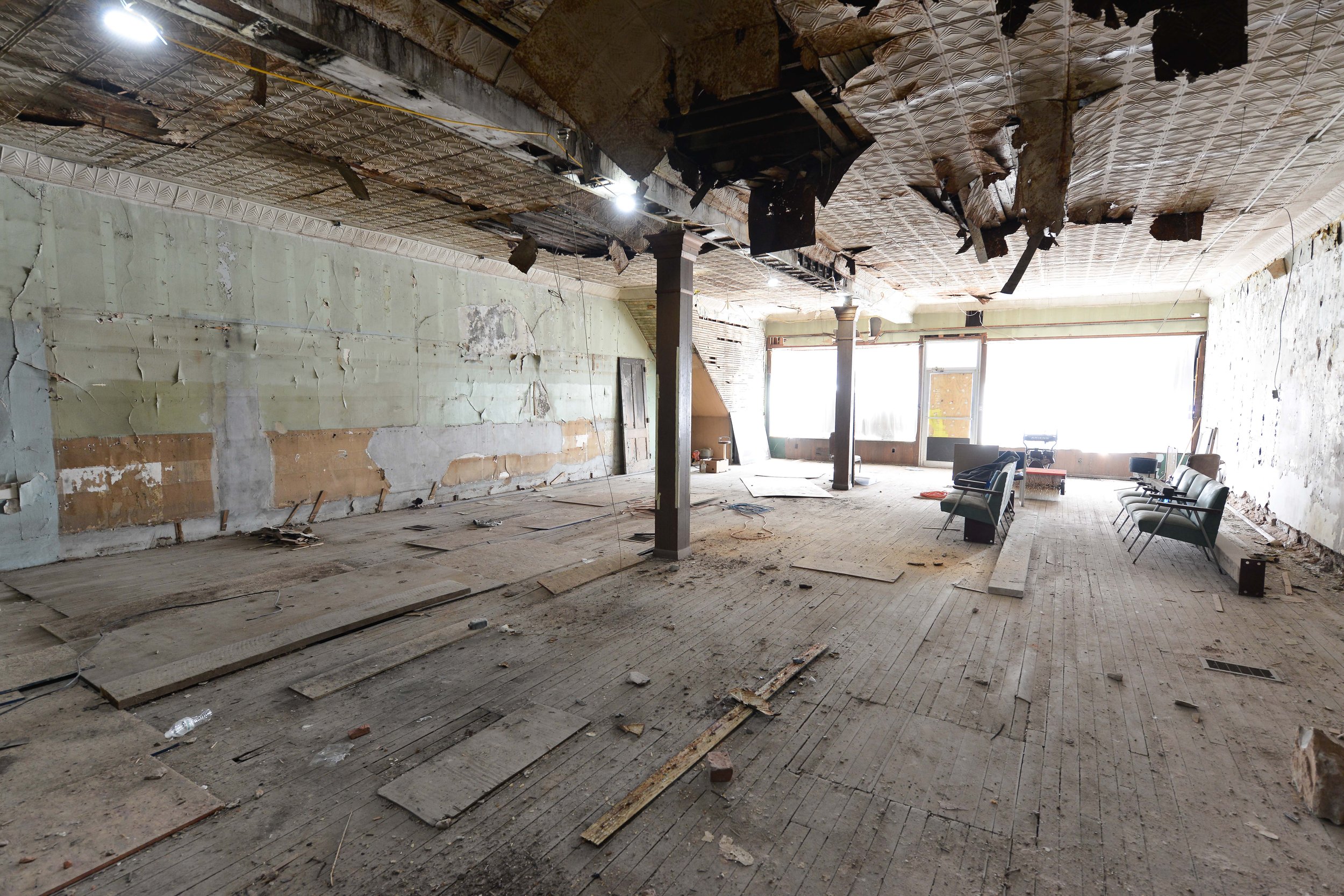 Interior space before renovation, facing the front storefront windows. Photo by John Smillie