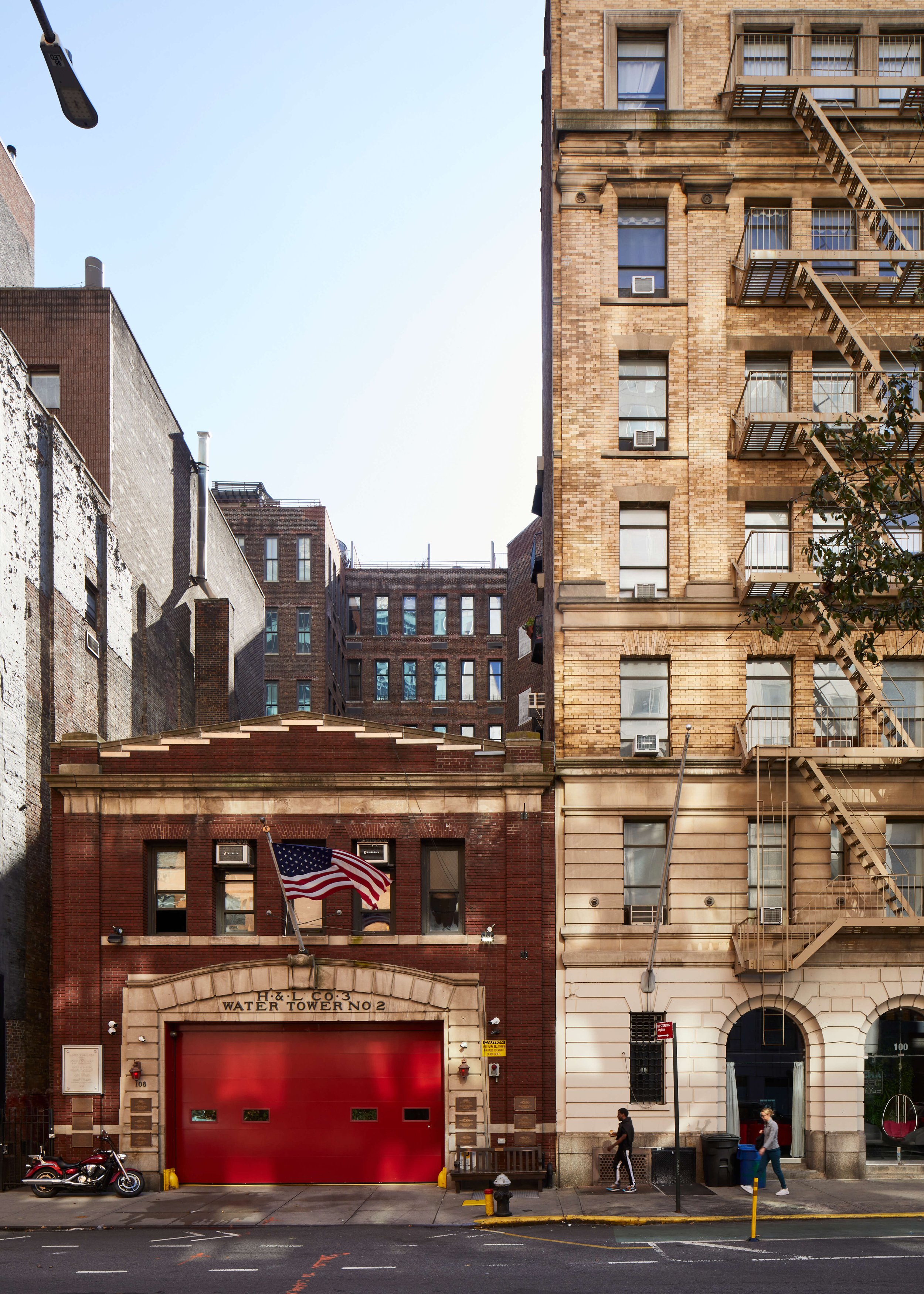  (l.) 106-108 East 13th Street is a 2-story firehouse constructed in 1928 for the NYFD (originally Hook &amp; Ladder Co. No. 3). Plaques on the exterior of the building attest that this house lost most of its men responding to the September 11th atta