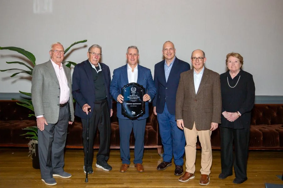 Olbiston LAH team with plaque (1).jpg