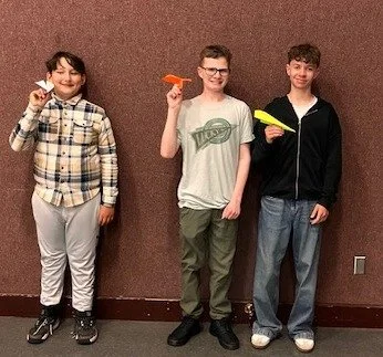 As Frank Sinatra's mellow voice crooned, "Come fly with me, let's fly, let's fly away" - Well, no one broke the flying record yesterday as RSTC had a paper airplanes construction and flying contest but they had alot of fun as they designed 