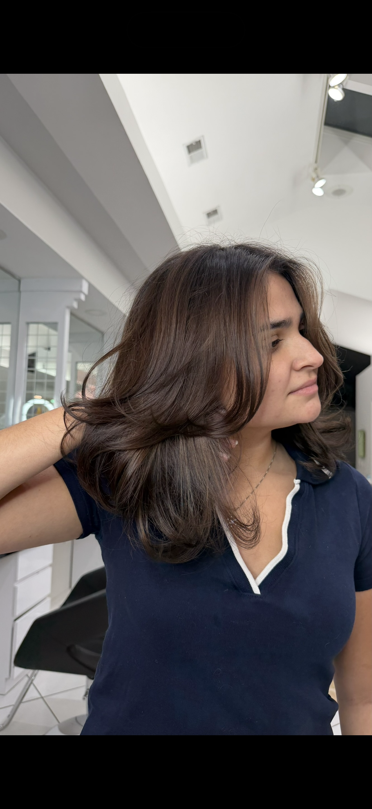 Bouncy, layered haircut performed at Bellibone Salon in Bergen County, NJ