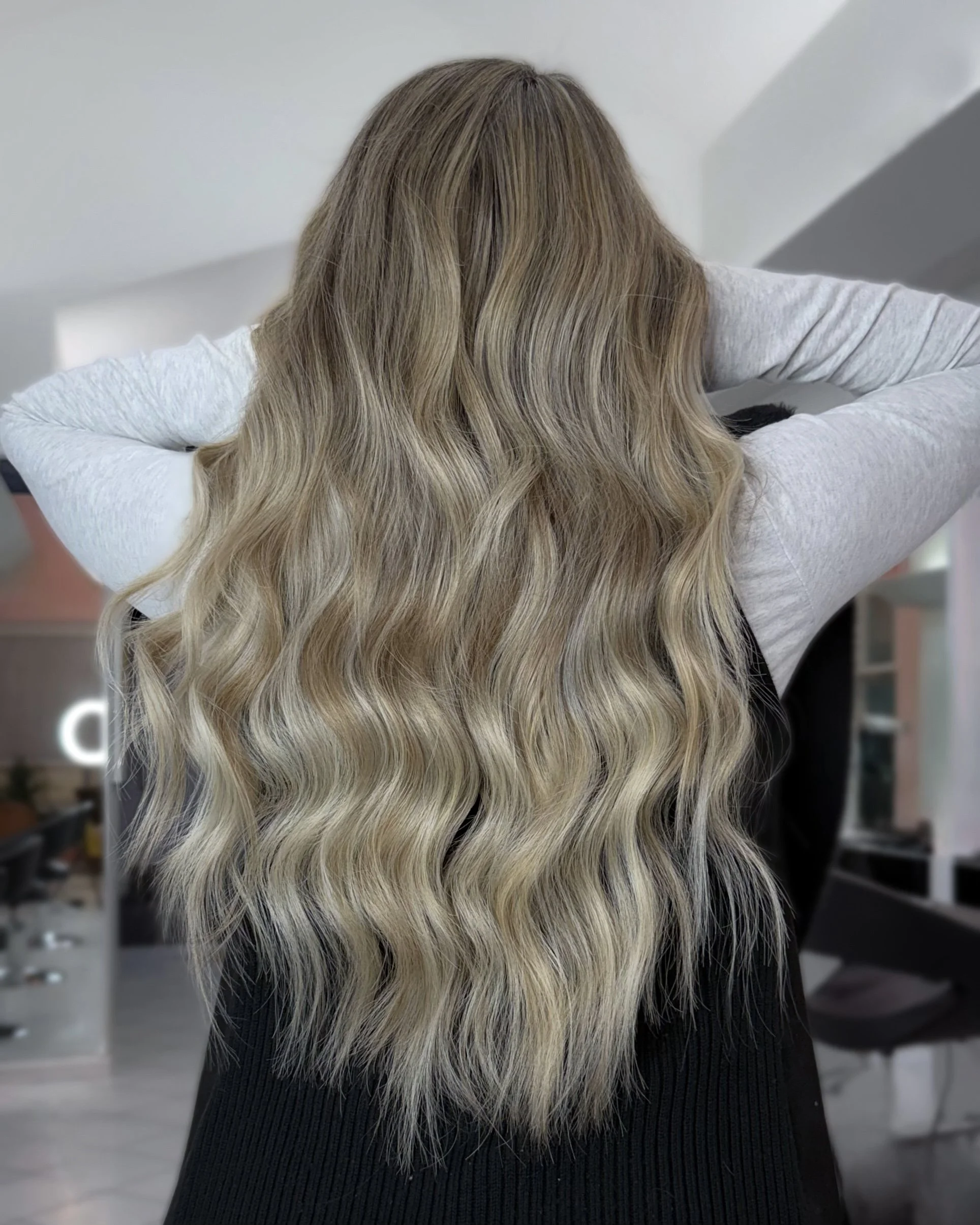 K-tip luxury hair extensions blonde transformation at Bellibone Salon in Bergen County, NJ.