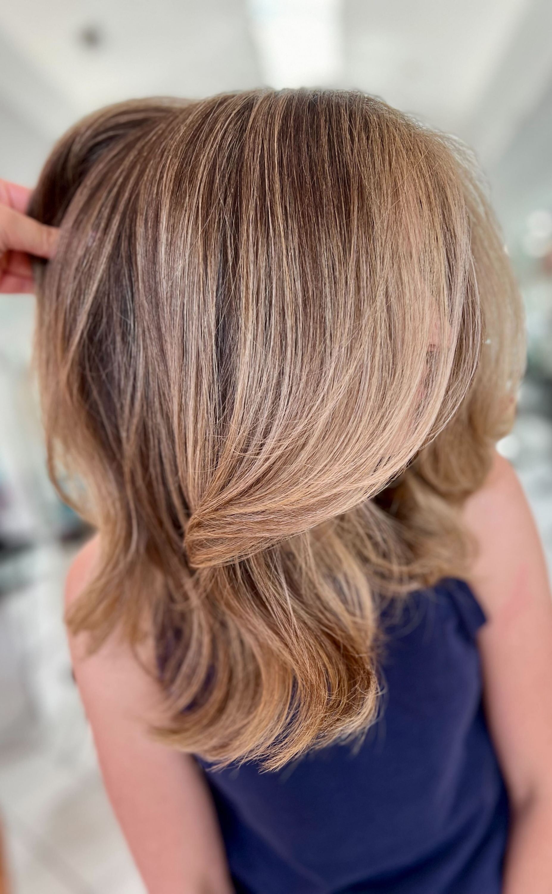 Lived-in balayage and layered butterfly haircut at Bellibone Salon in Bergen County, NJ,