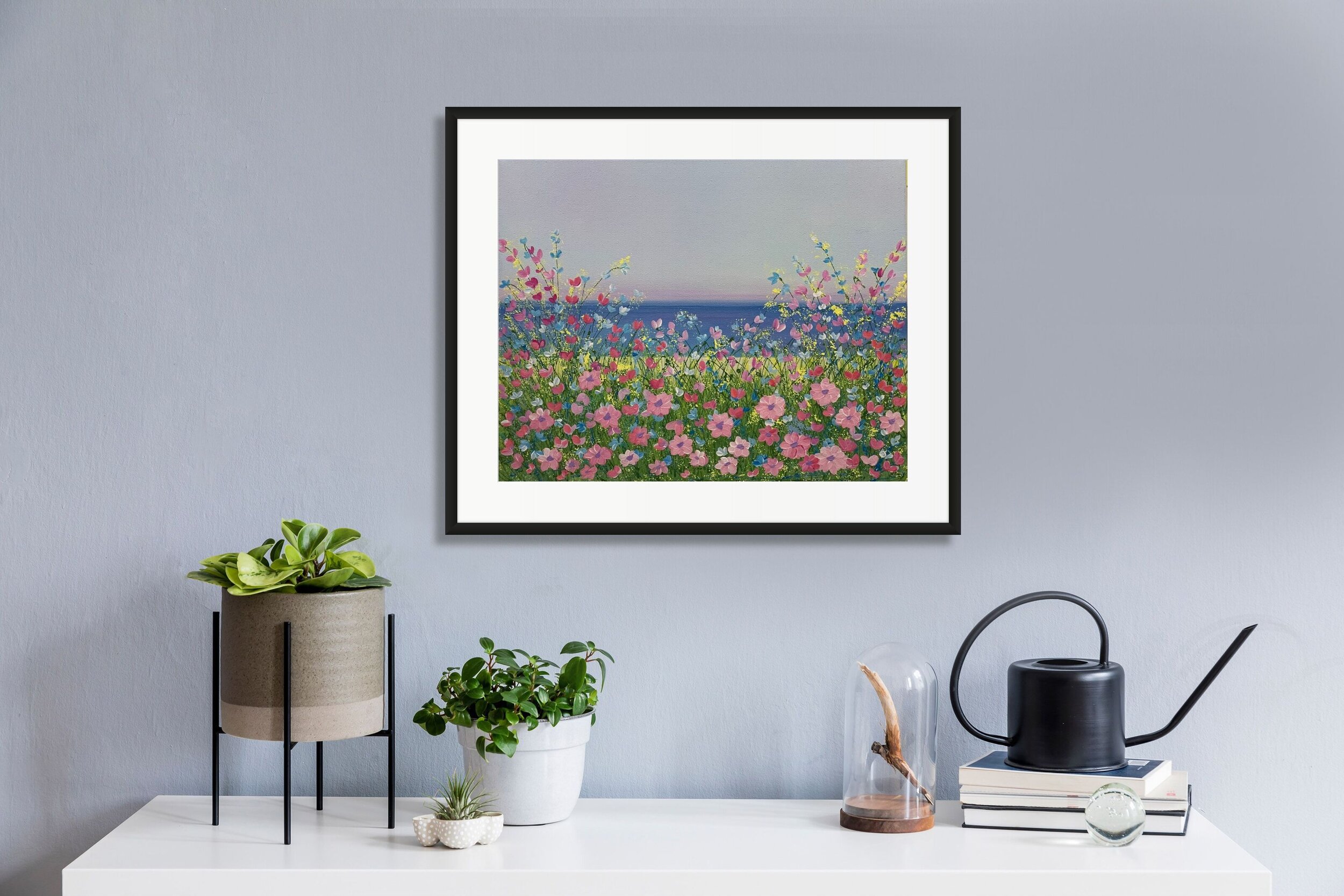 whimsical floral lakeside art above potted plants.jpg