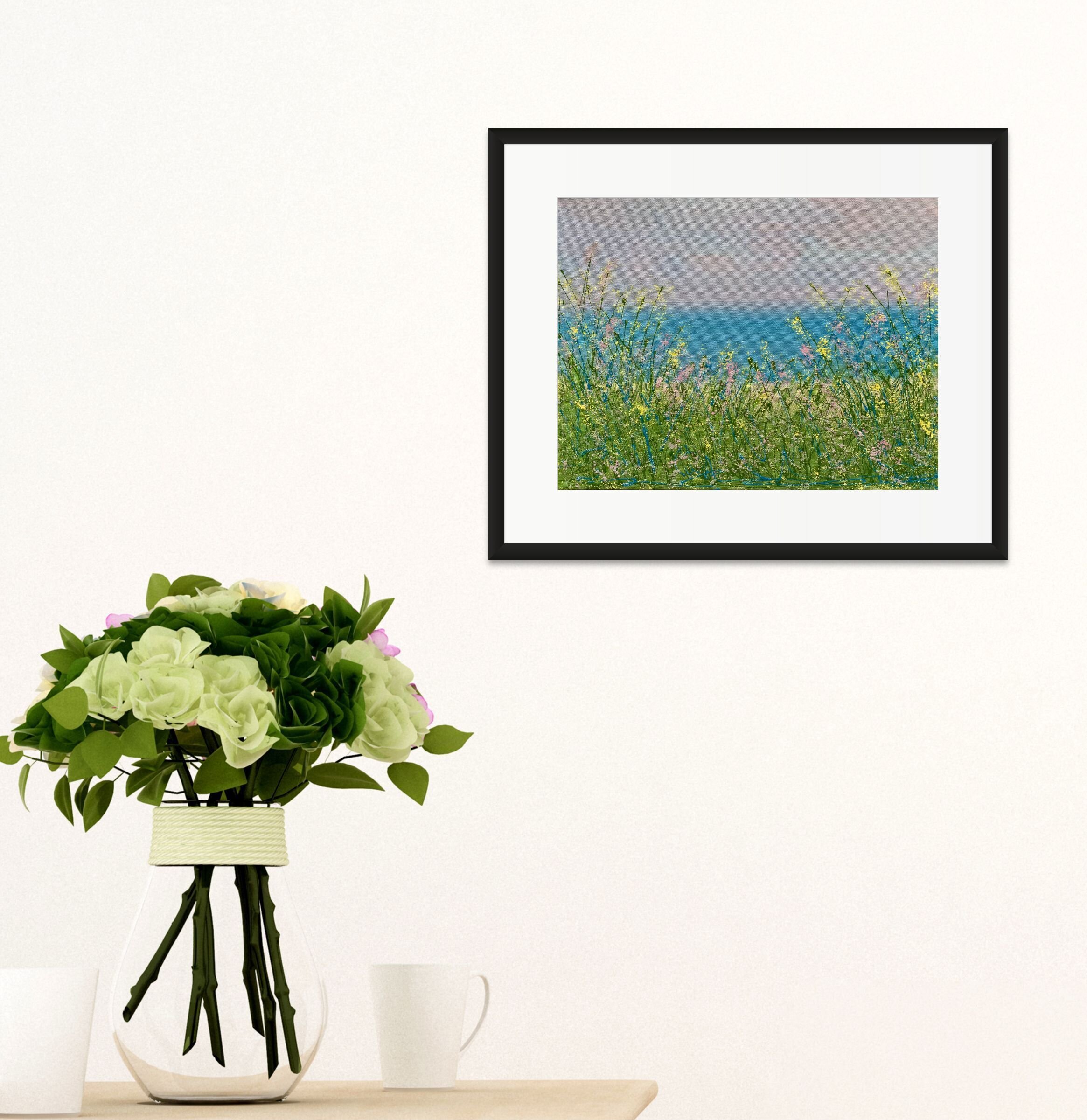 floral lakeside painting next to clear vase with white flowers.jpg