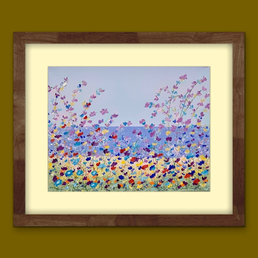 floral lakeside painting with yellow matting and brown frame on lighter brown wall
