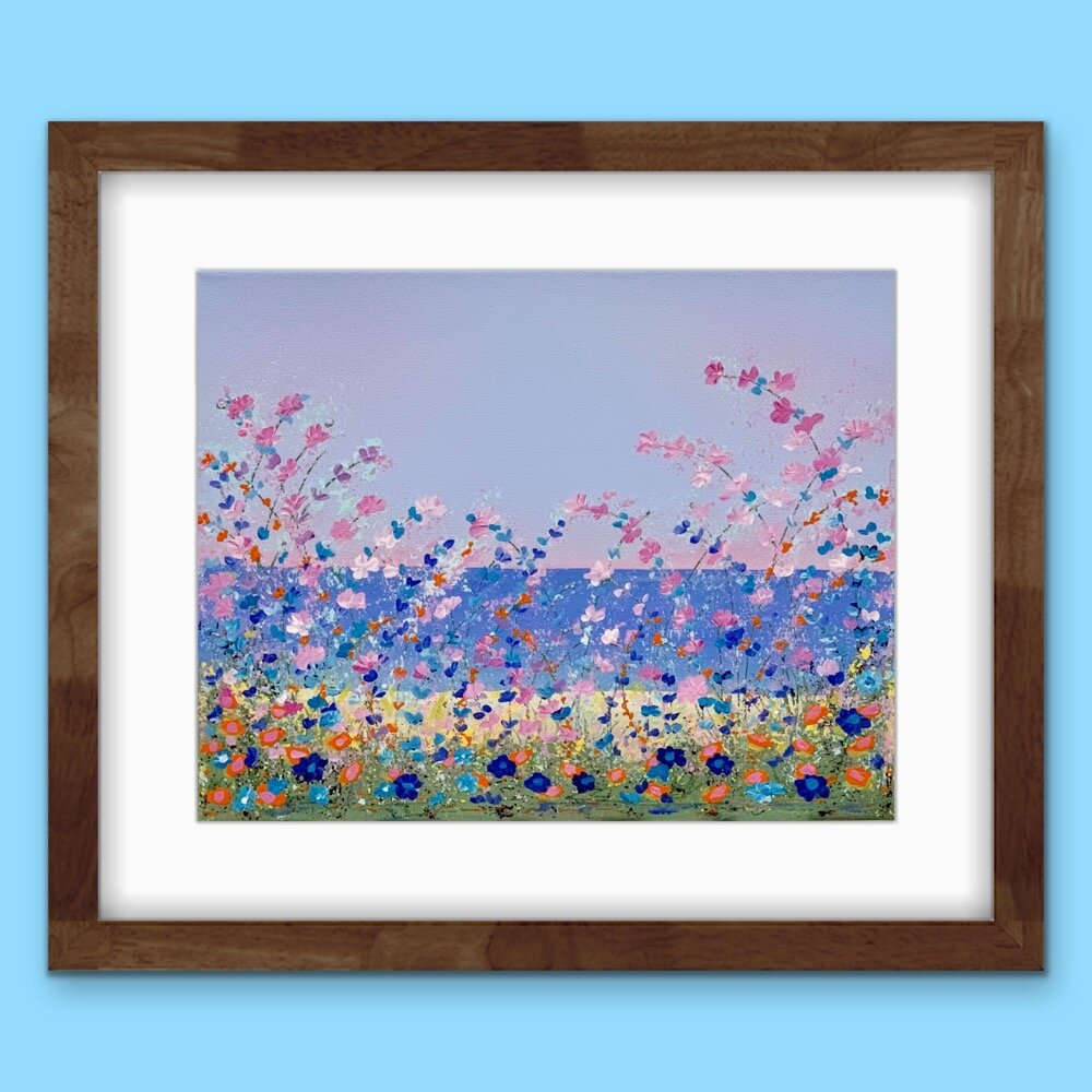 floral lakeside painting with white mat and dark brown frame on light blue wall