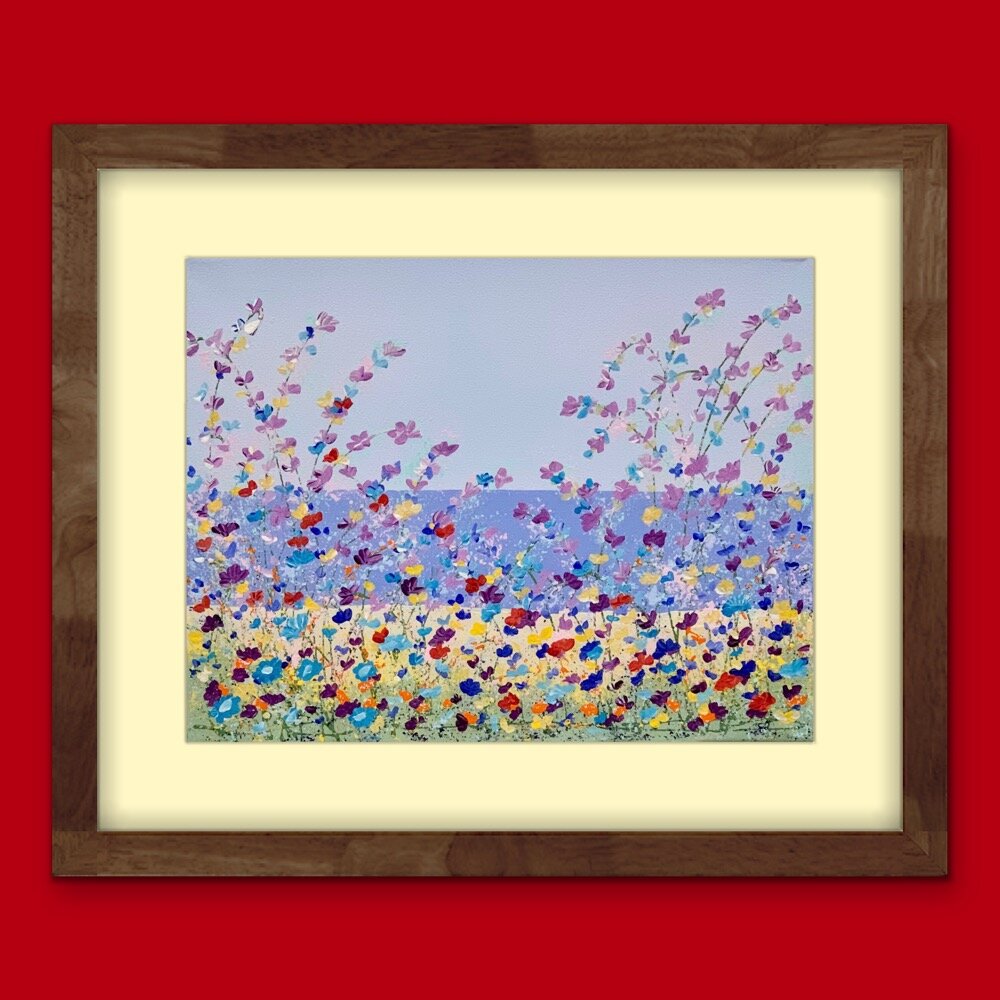 floral lakeside painting with yellow mat and dark brown frame on red wall