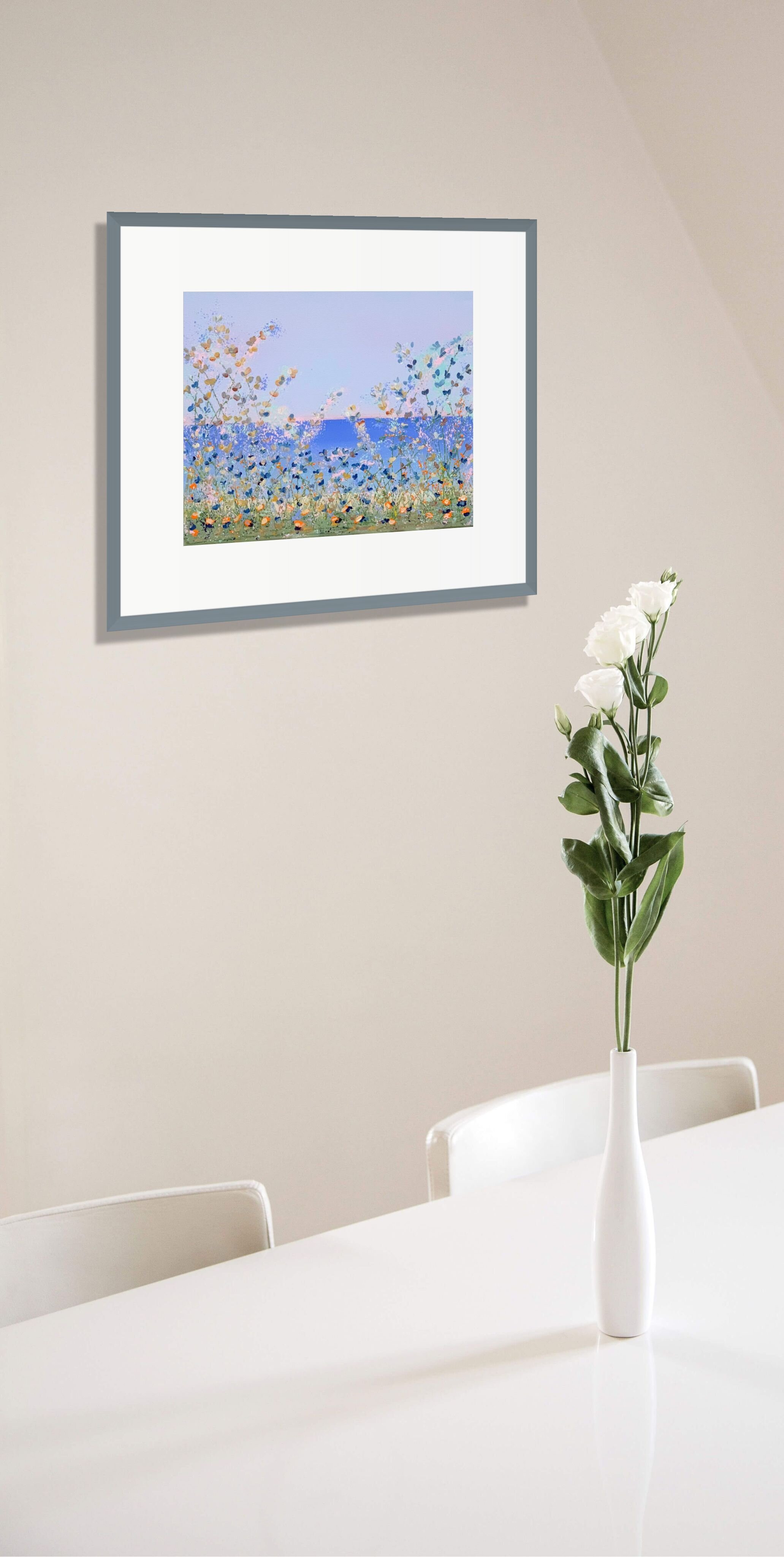 floral painting next to table with flower