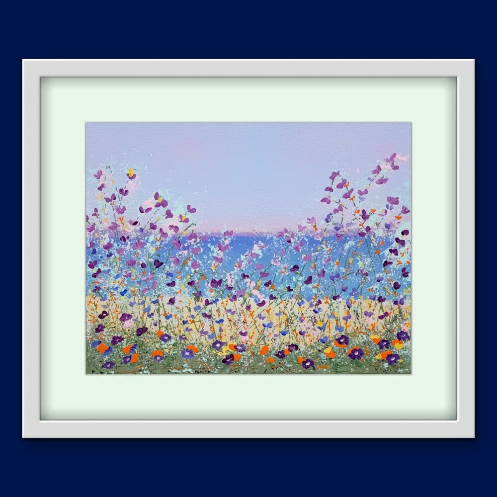 floral lakeside painting with light green mat and white frame on dark blue wall