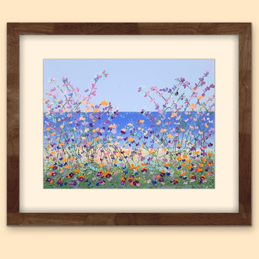 floral lakeside painting with light beige mat and brown wood frame on beige wall