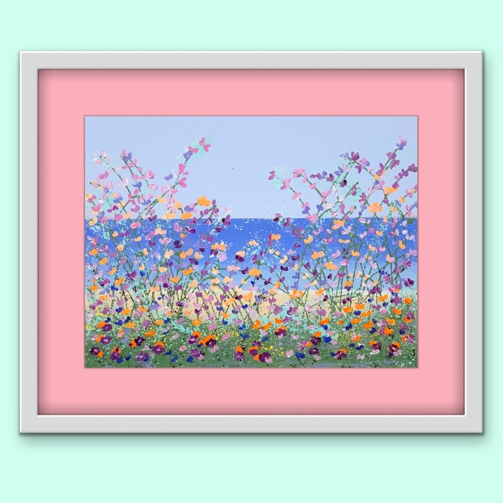 floral lakeside painting with coral mat and white frame on light green wall