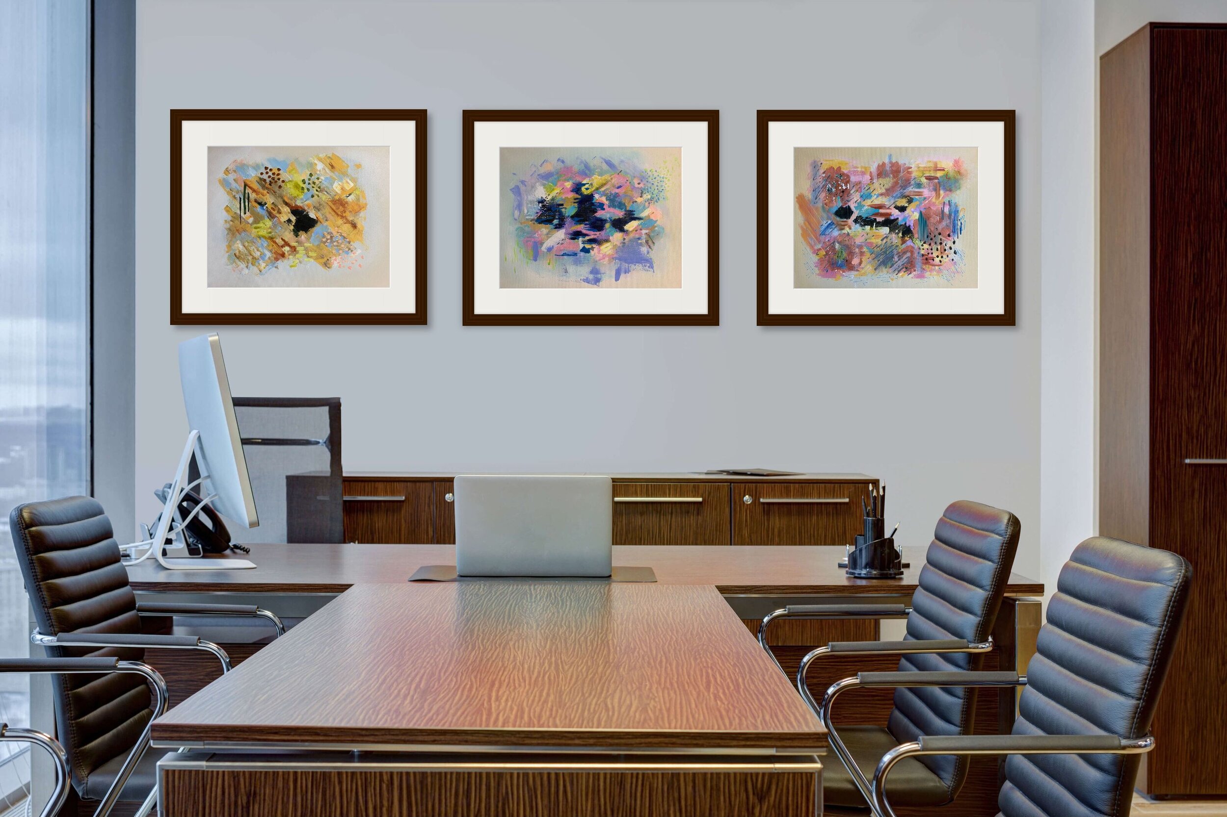 three gestural paintings on boardroom wall