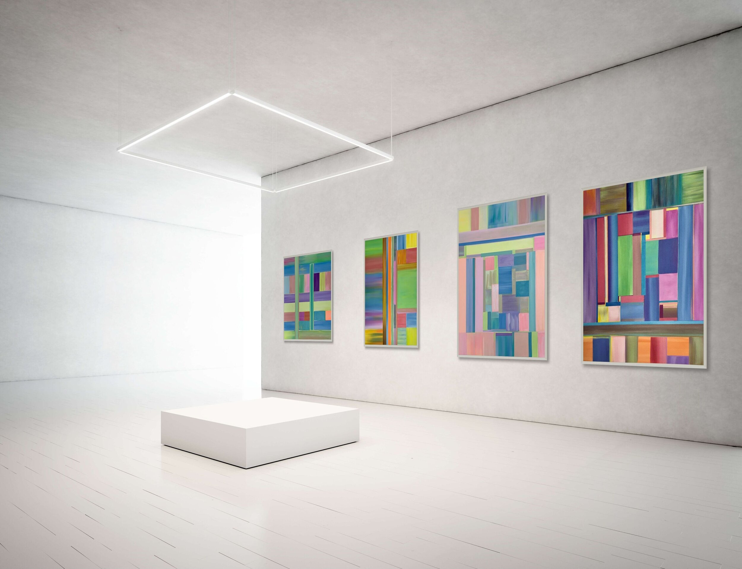 four geometric abstract paintings on gallery wall