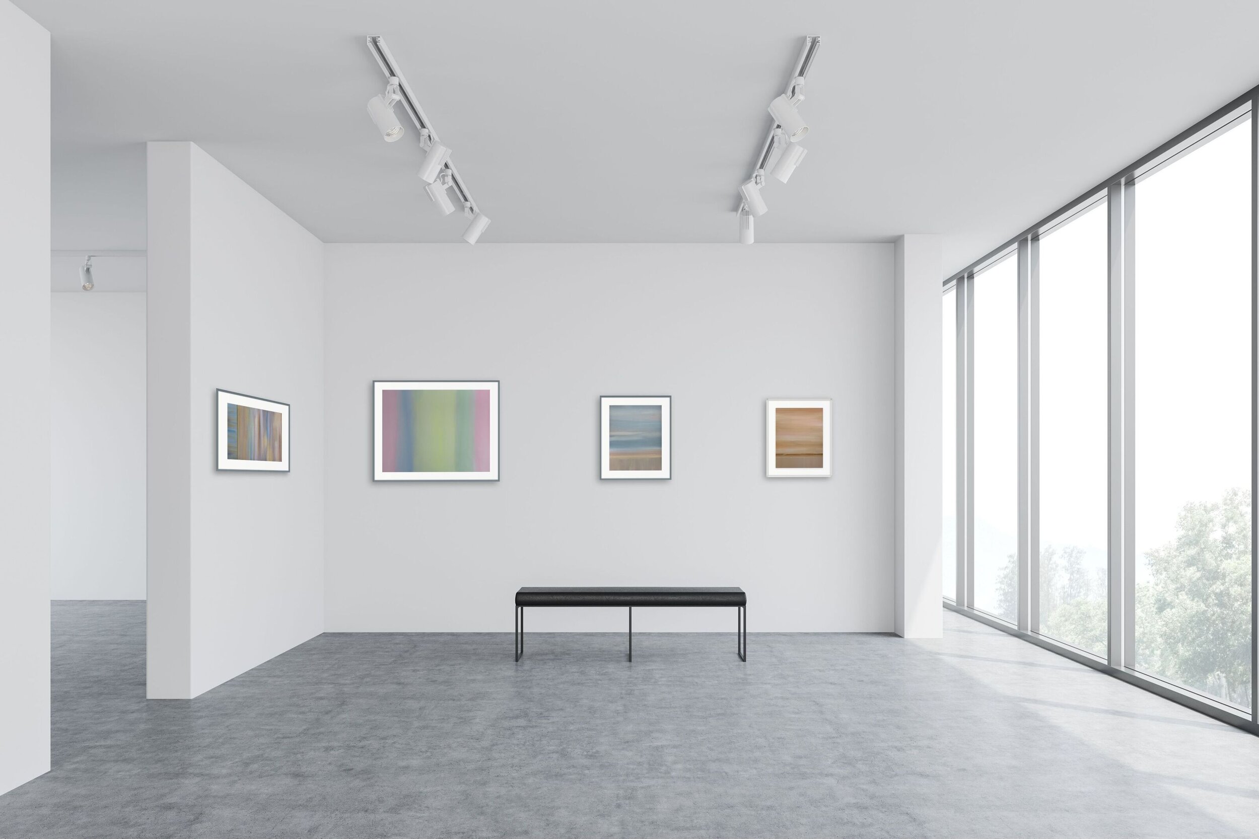 four minimalist paintings with pastel colors in gallery